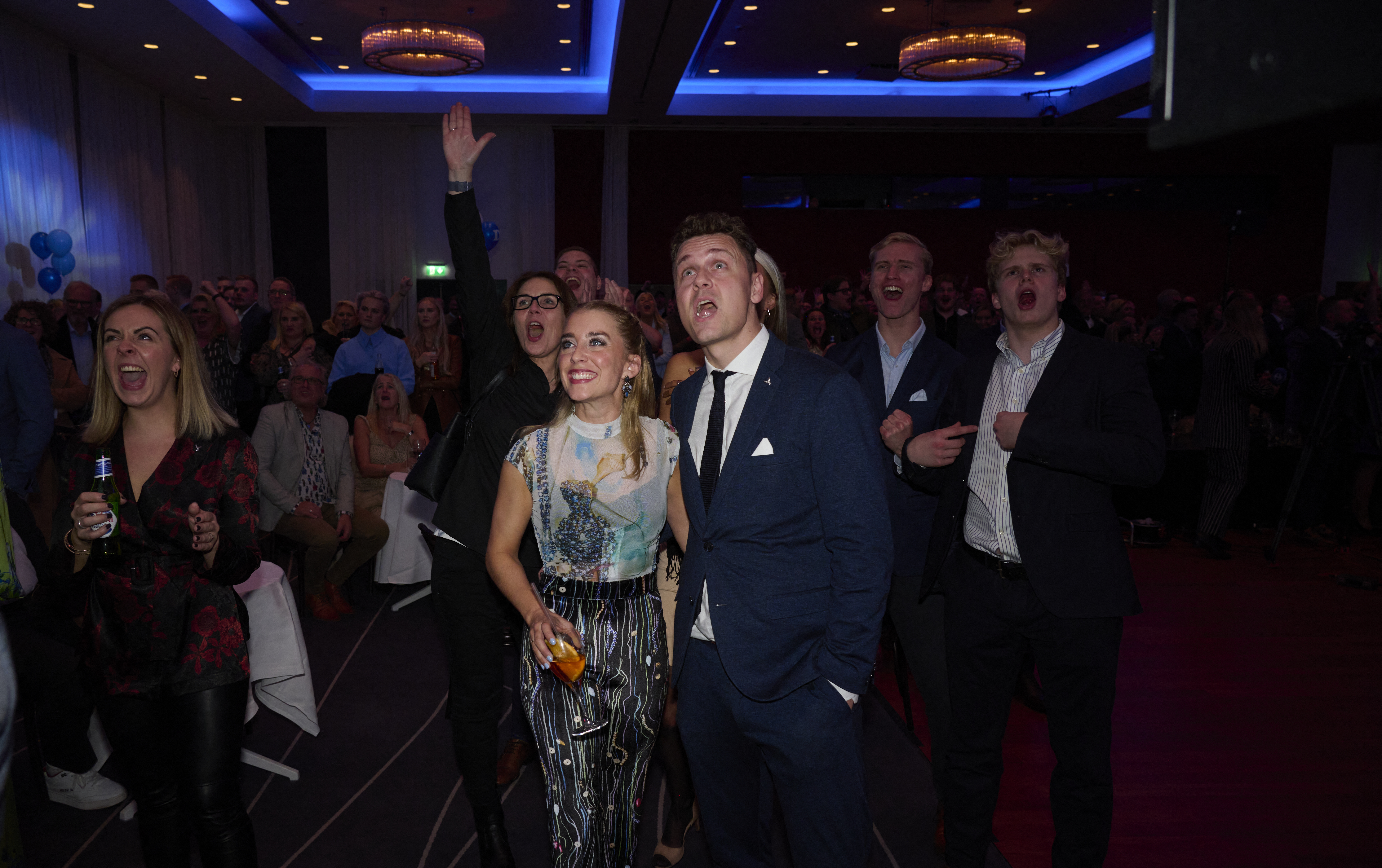 Iceland’s finance minister, leader and top candidate of the Icelandic Independence Party, Bjarni Benediktsson, (centre,R) and party delegates react to the results being shown on a monitor in Iceland’s capital Reykjavik