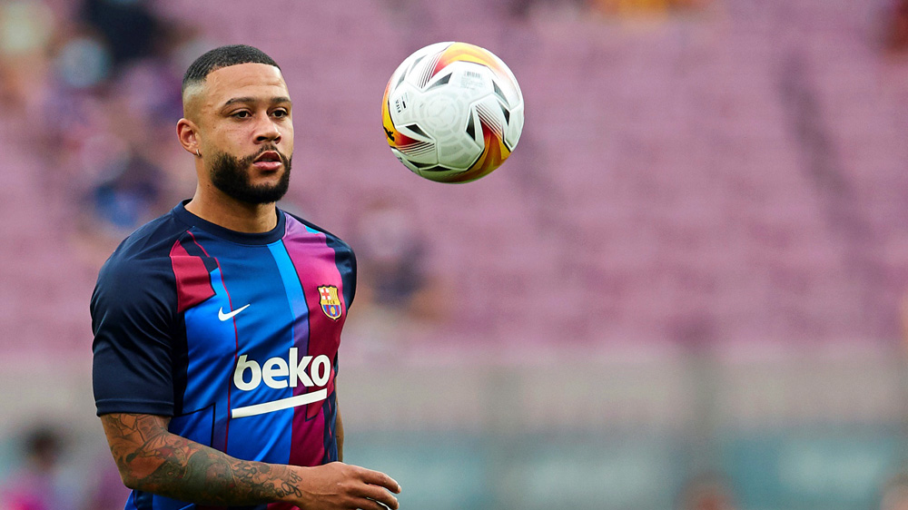 Barcelona's striker Memphis Depay warms up ahead of a Spanish LaLiga soccer match between FC Barcelona and Real Sociedad at Camp Nou in Barcelona, Spain, 15 August 2021
