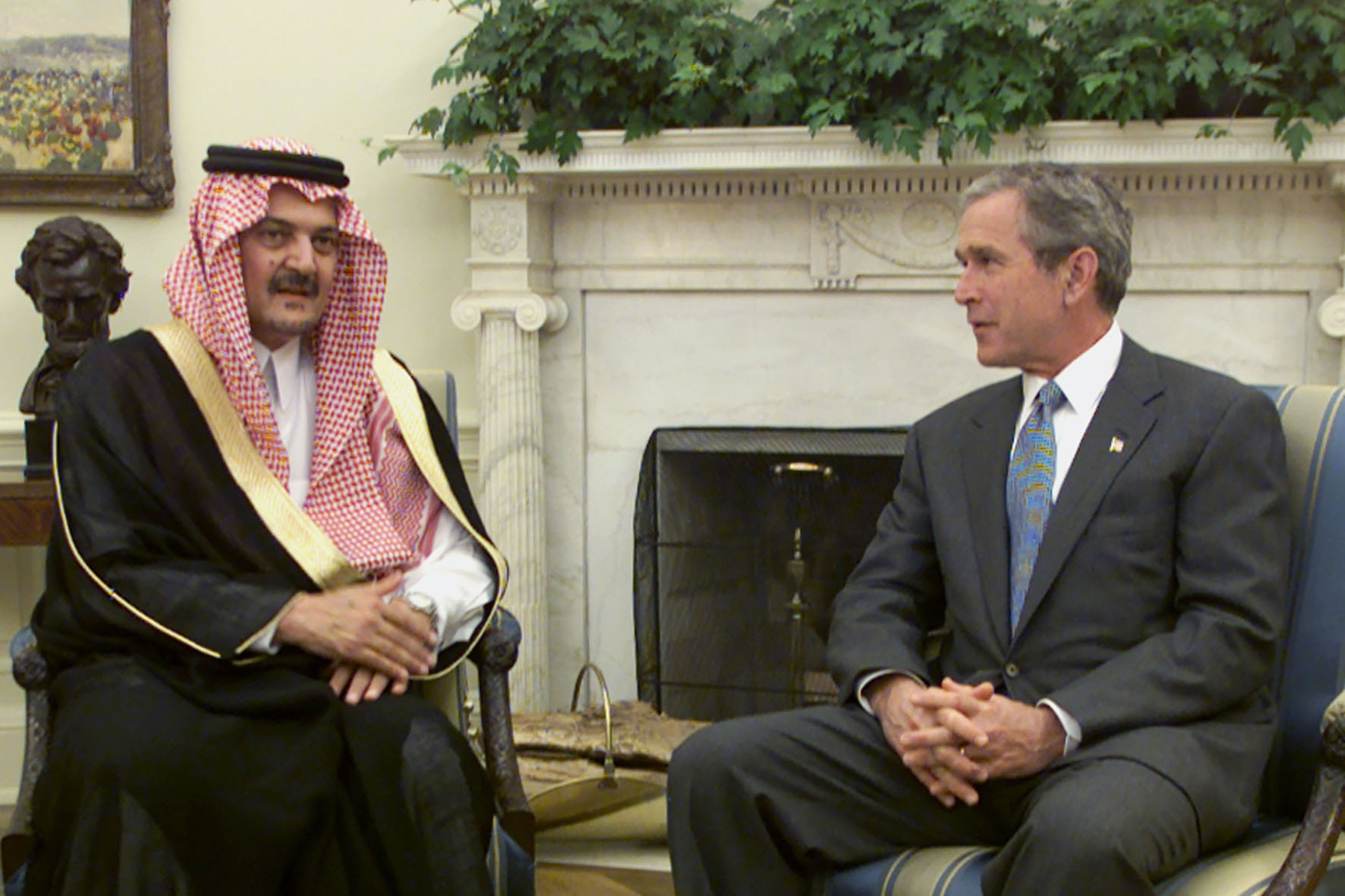 US President George W Bush speaks with Saudi Arabia's Foreign Minister Prince Saud al-Faisal at the White House on September 20, 2001 [Reuters]