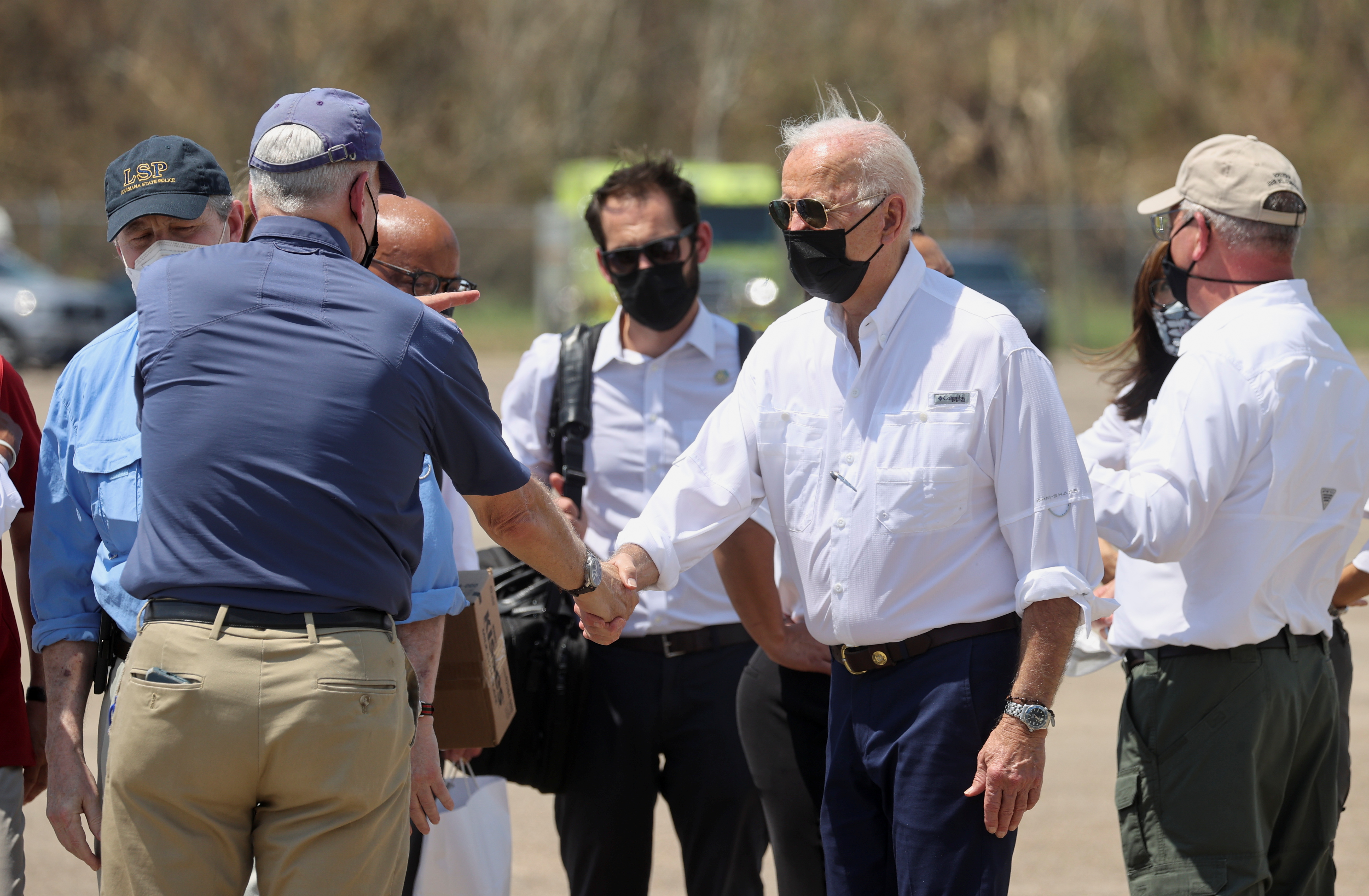 US President Joe Biden greets elected officials on the tarmac after arriving at Louis Armstrong New Orleans International Airport in Kenner as he begins his tour of the hurricane-affected areas in Louisiana, US