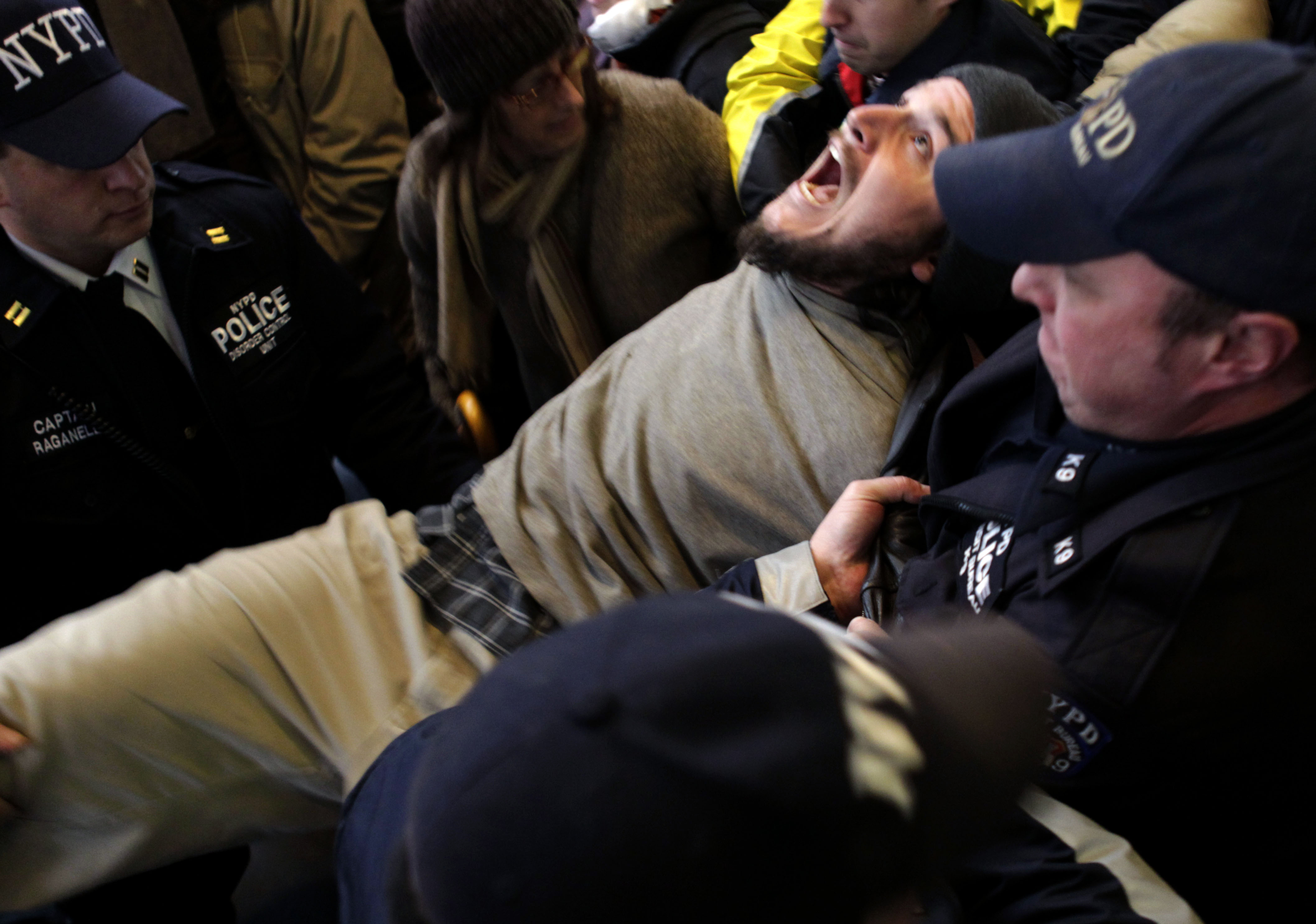 An Occupy Wall Street protester yells as he is arrested by the police after blocking an intersection near The New York Stock Exchange in New York in November 2011