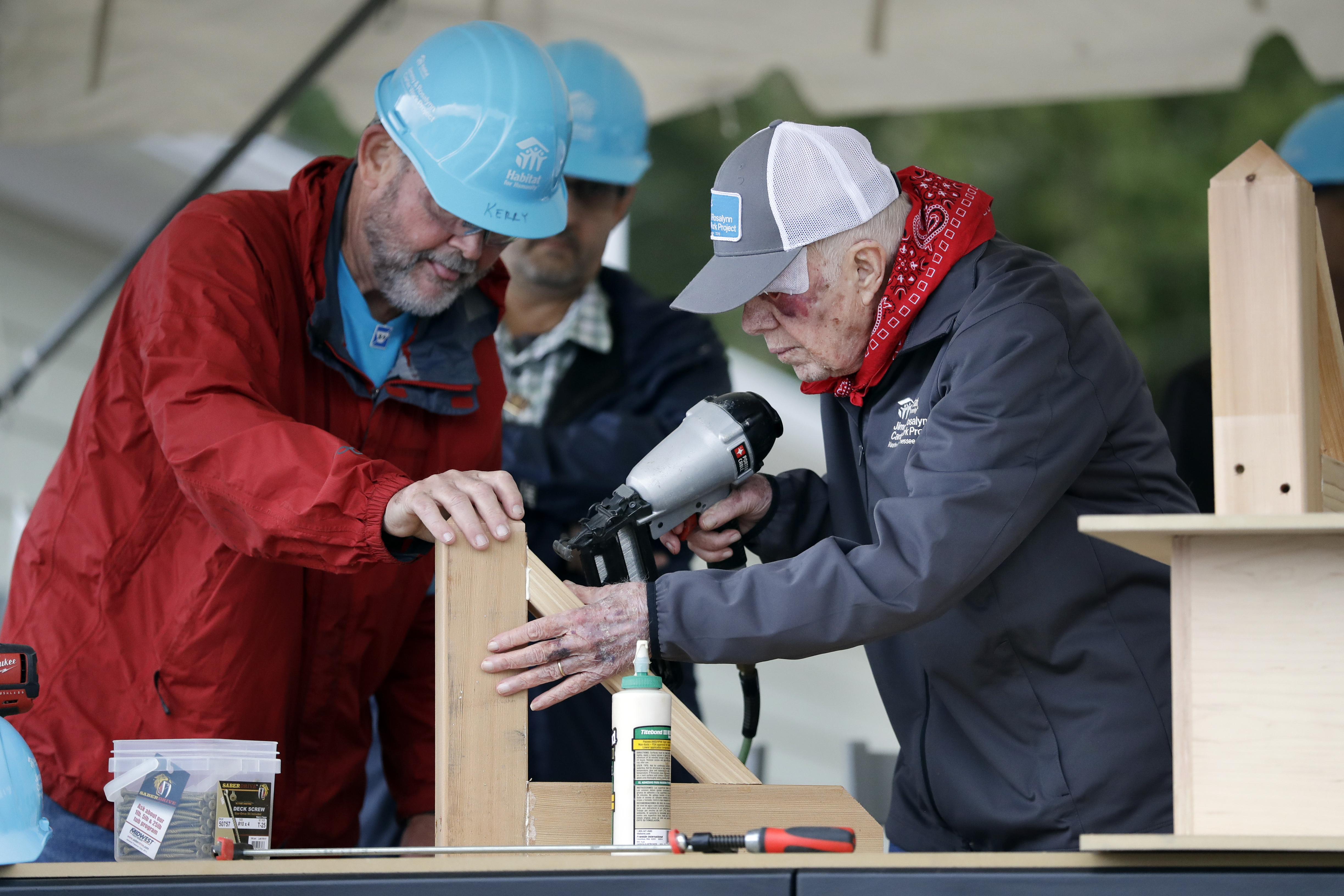 Former President Jimmy Carter works at a Habitat for Humanity building project in 2019