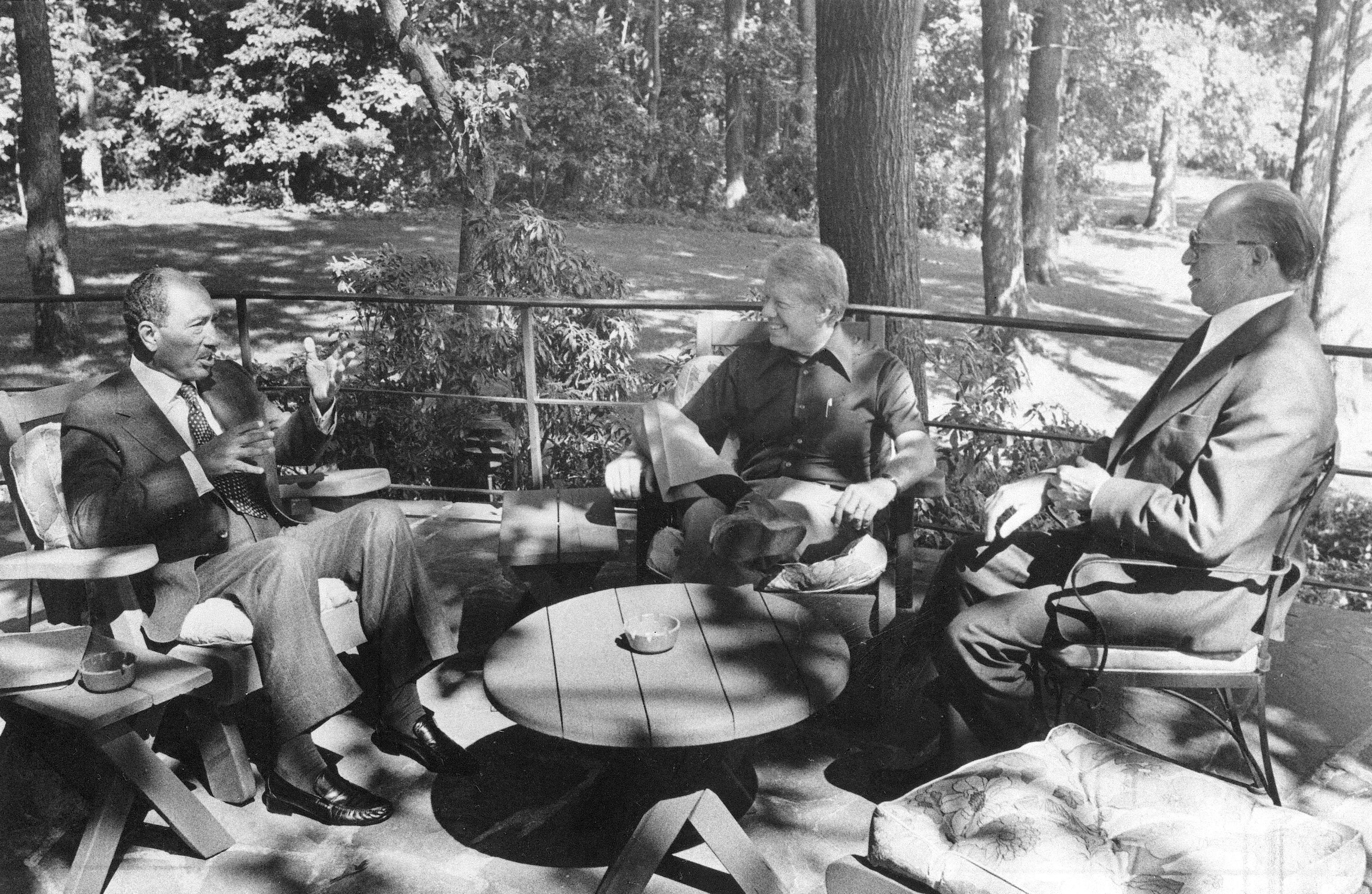 Egyptian President Anwar Sadat, left, US President Jimmy Carter, centre, and Israeli Prime Minister Menachem meet for the first time at Camp David in 1978 [The Associated Press]