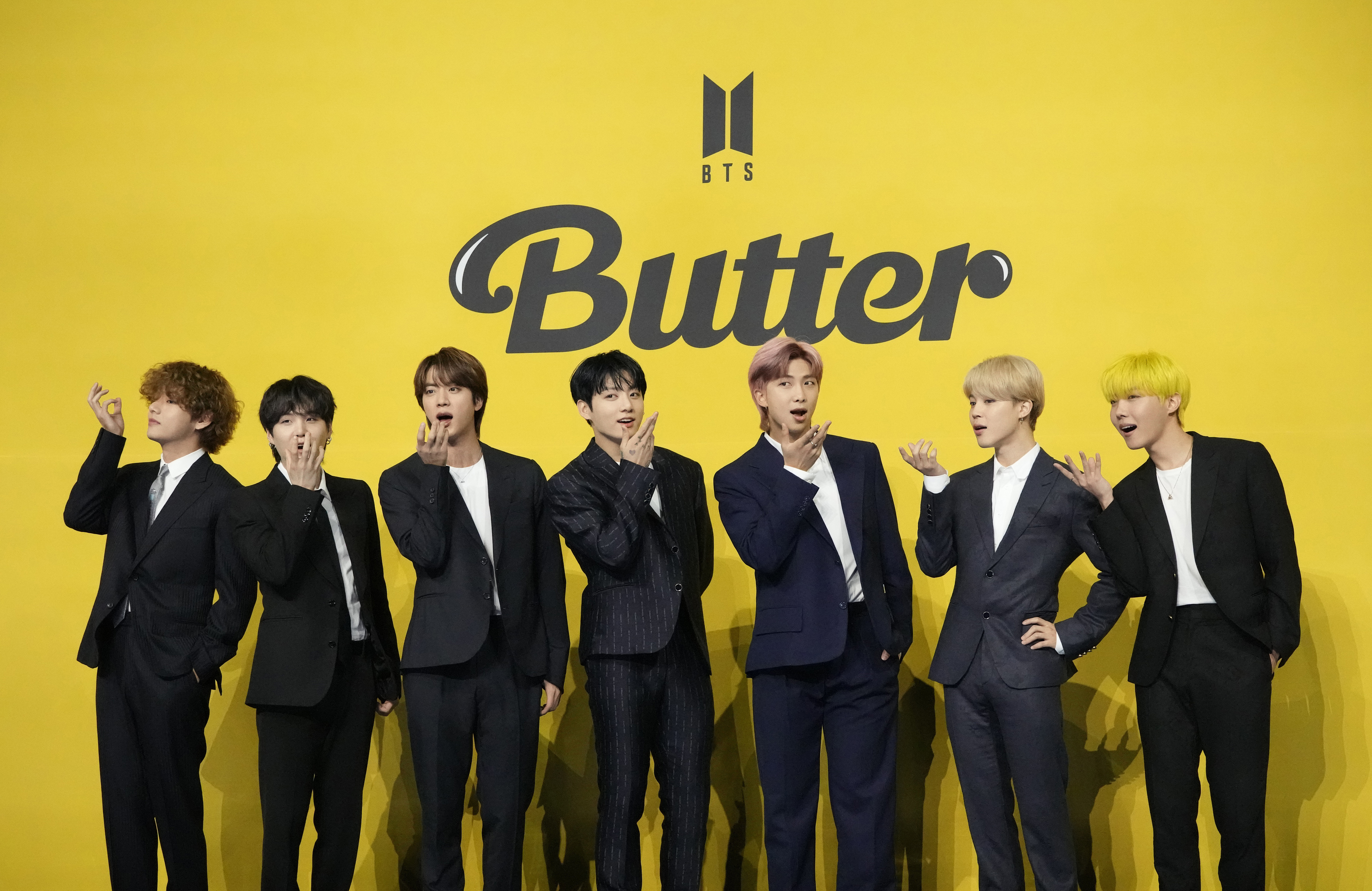 South Korean K-pop band BTS pose for photographers ahead of a press conference to introduce their single “Butter” in Seoul, South Korea