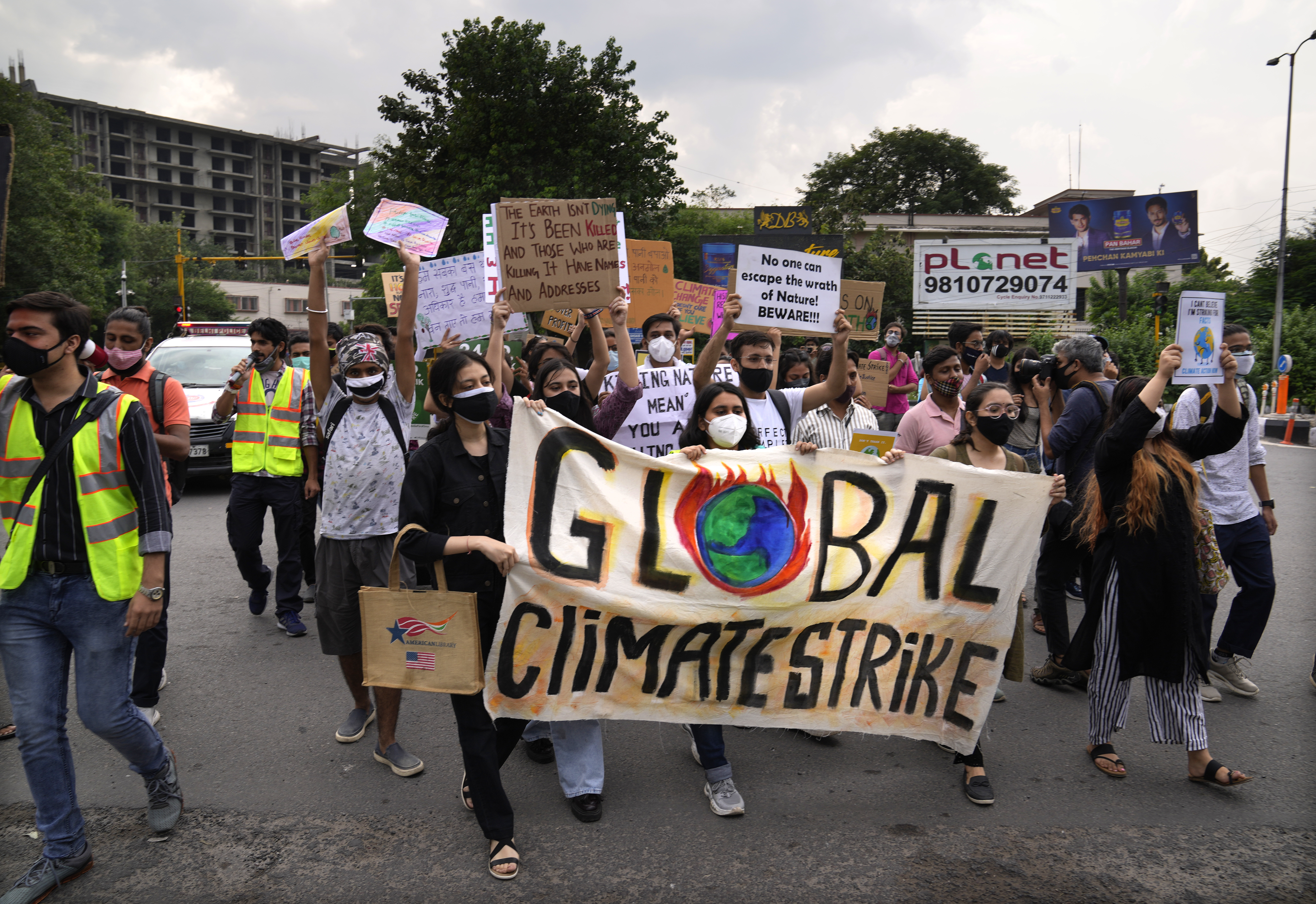 Activists hold banners during a protest march as part of the Fridays for Future climate movement’s initiatives, in New Delhi, India