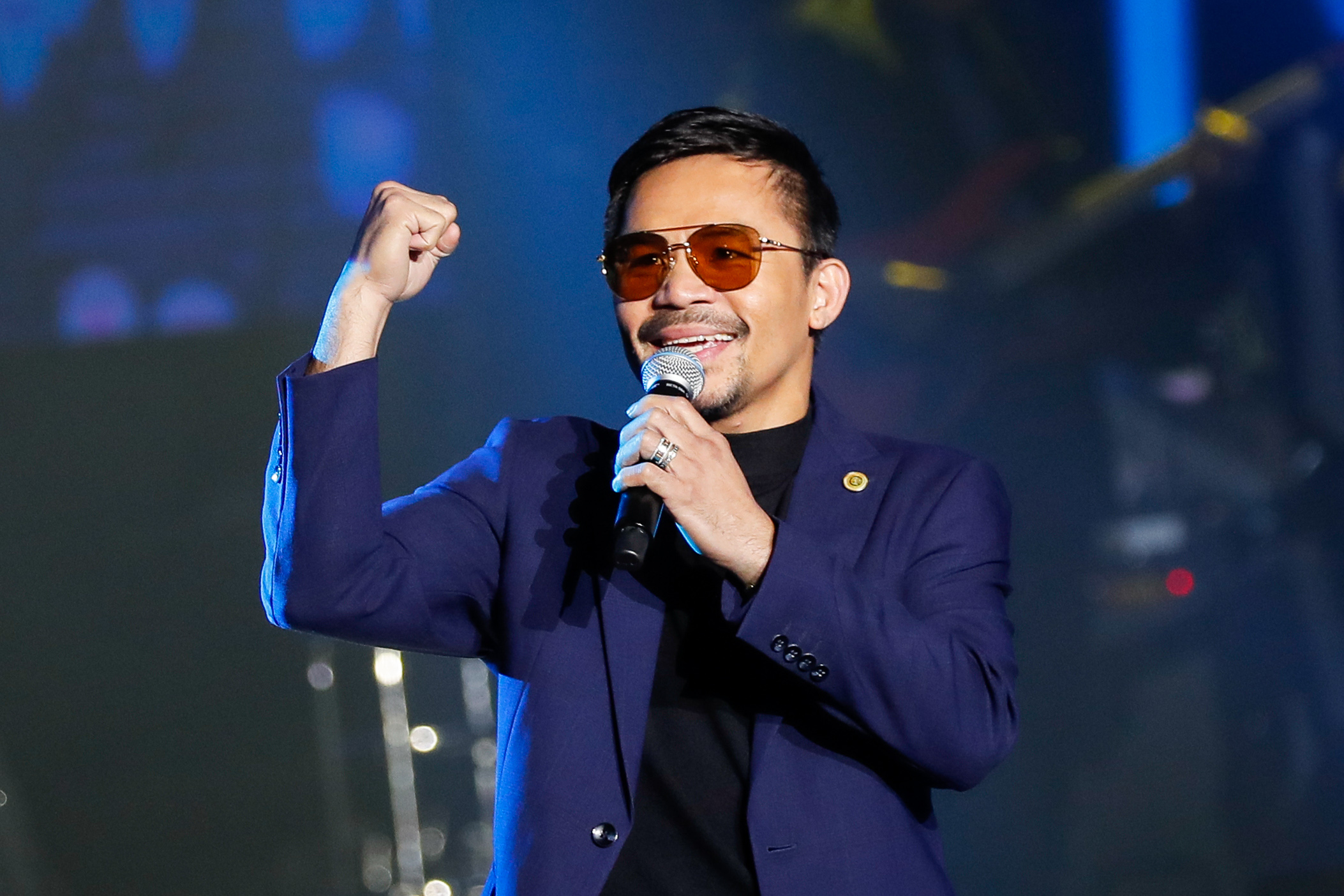 Senator Pacquiao performs during the launch of his own cryptocurrency in Manila in 2019