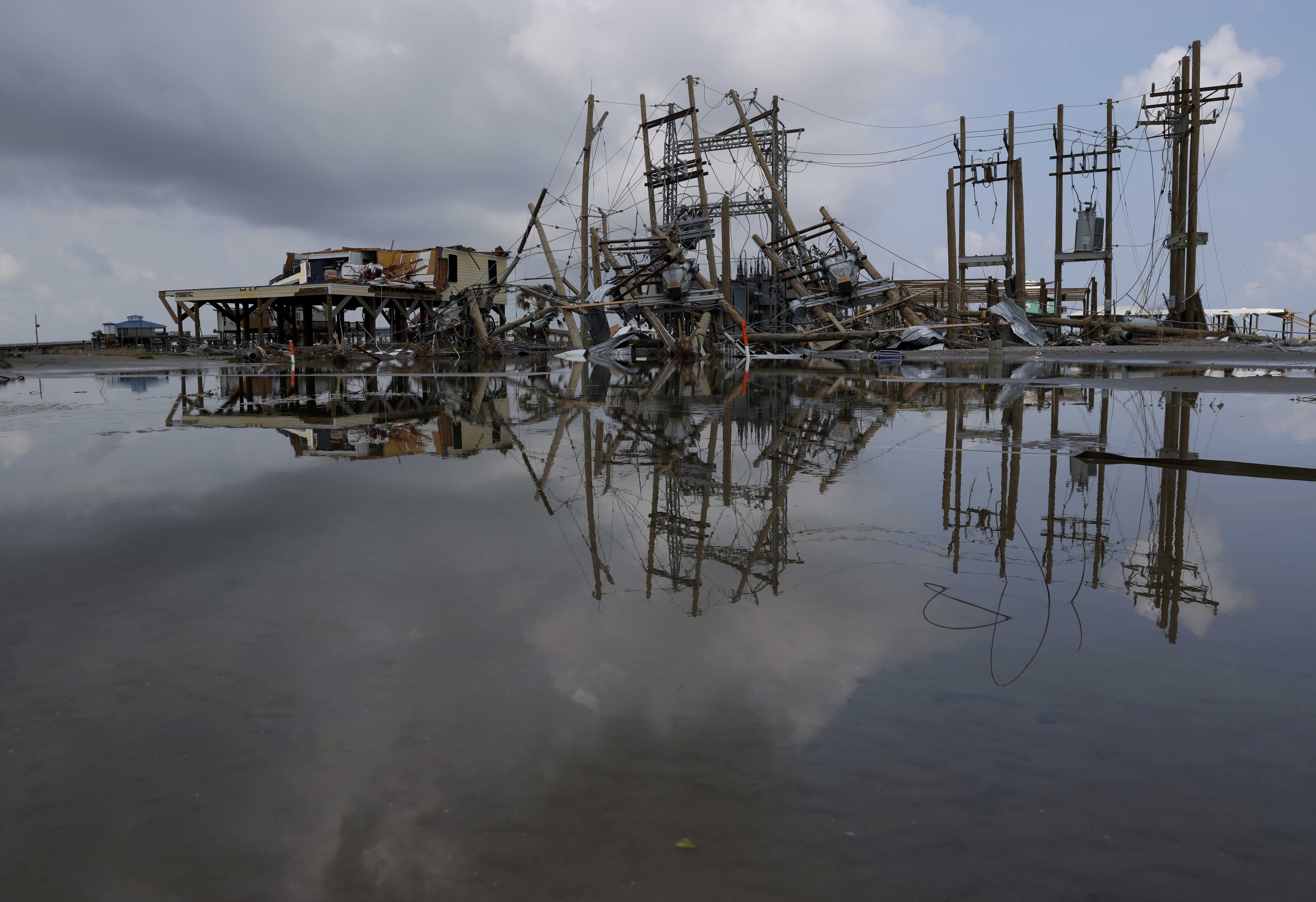 Damaged power lines and homes can be seen days after hurricane Ida ripped through Grand Isle, Louisiana in the United States