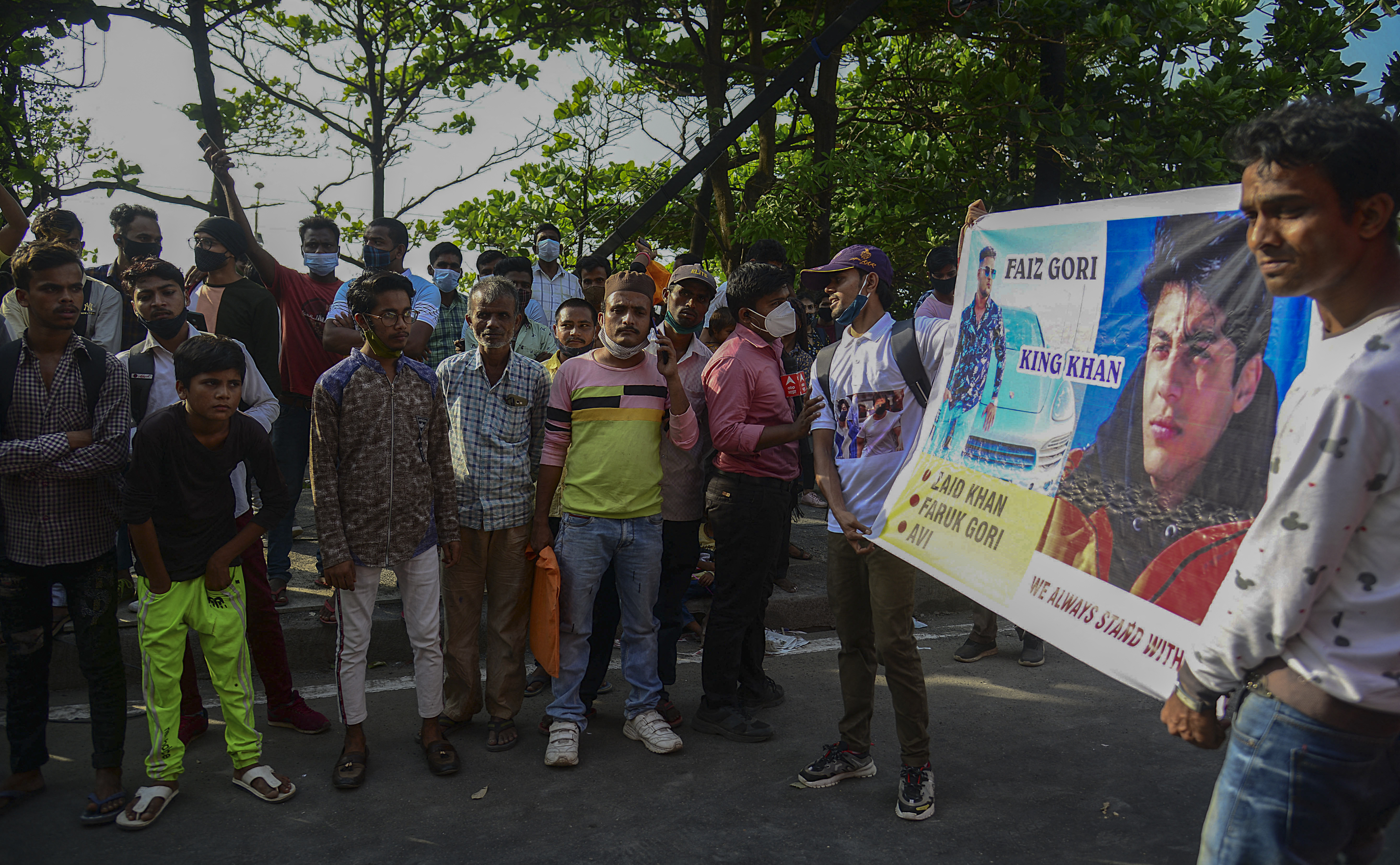 Fans gathered with banners of Bollywood actor Shah Rukh Khan and his son Aryan Khan, outside his residence, to celebrate Aryan Khan’s release on bail on Friday