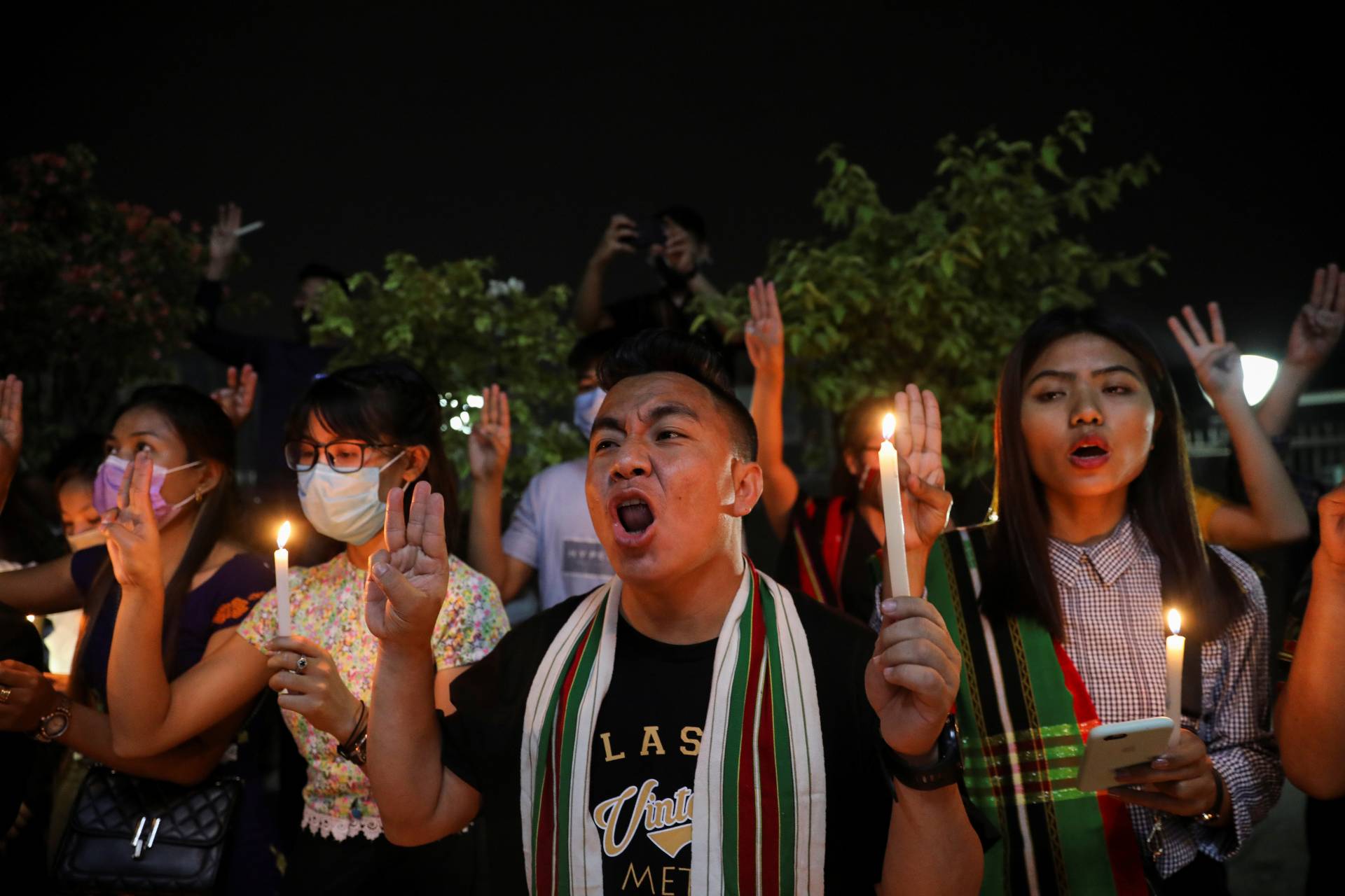 An organisation of Myanmar students from India’s Mizoram state, hold a candle vigil to pay tribute to people who died in Myanmar after the military coup