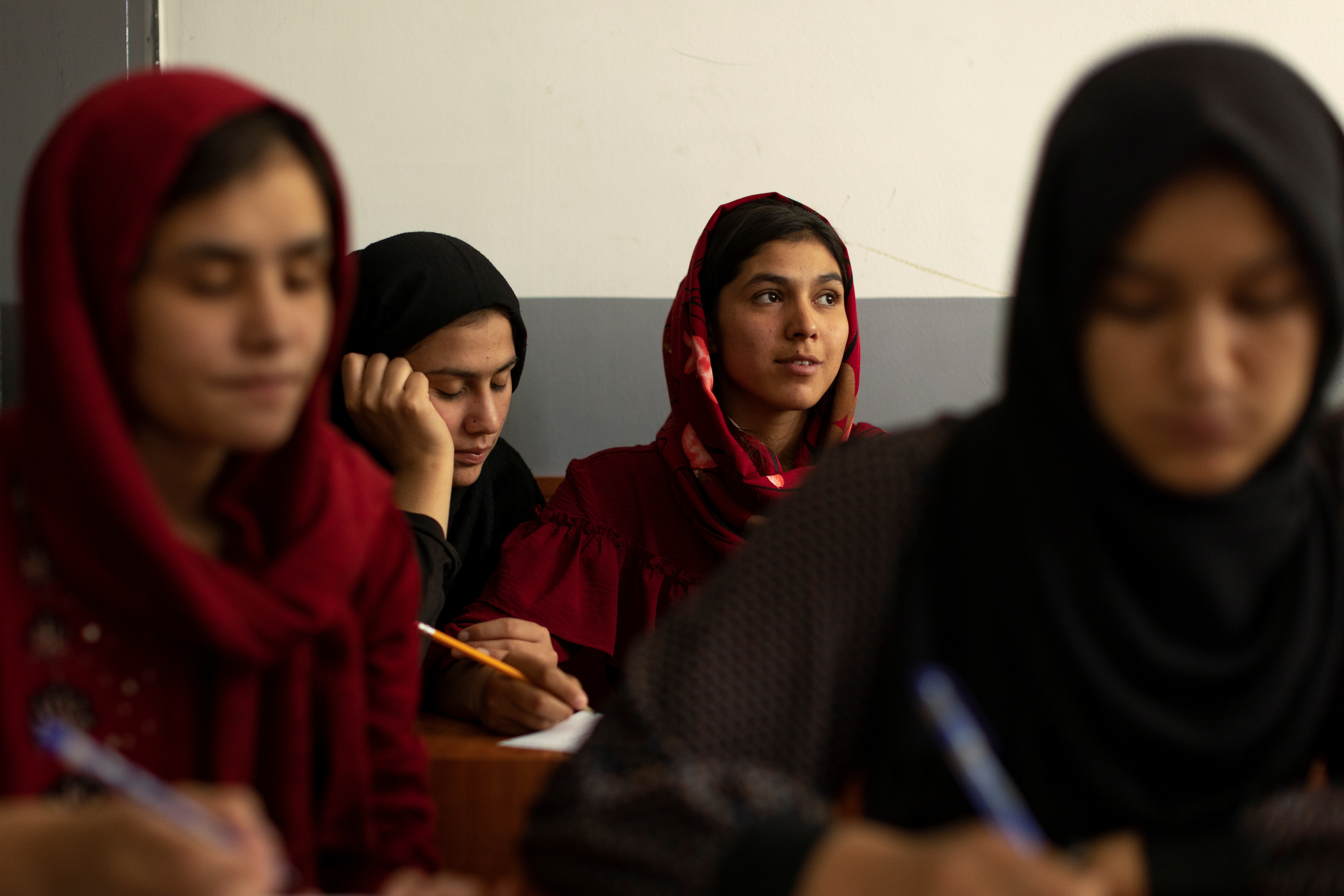 Afghan girls attend lessons at an orphanage in capital Kabul