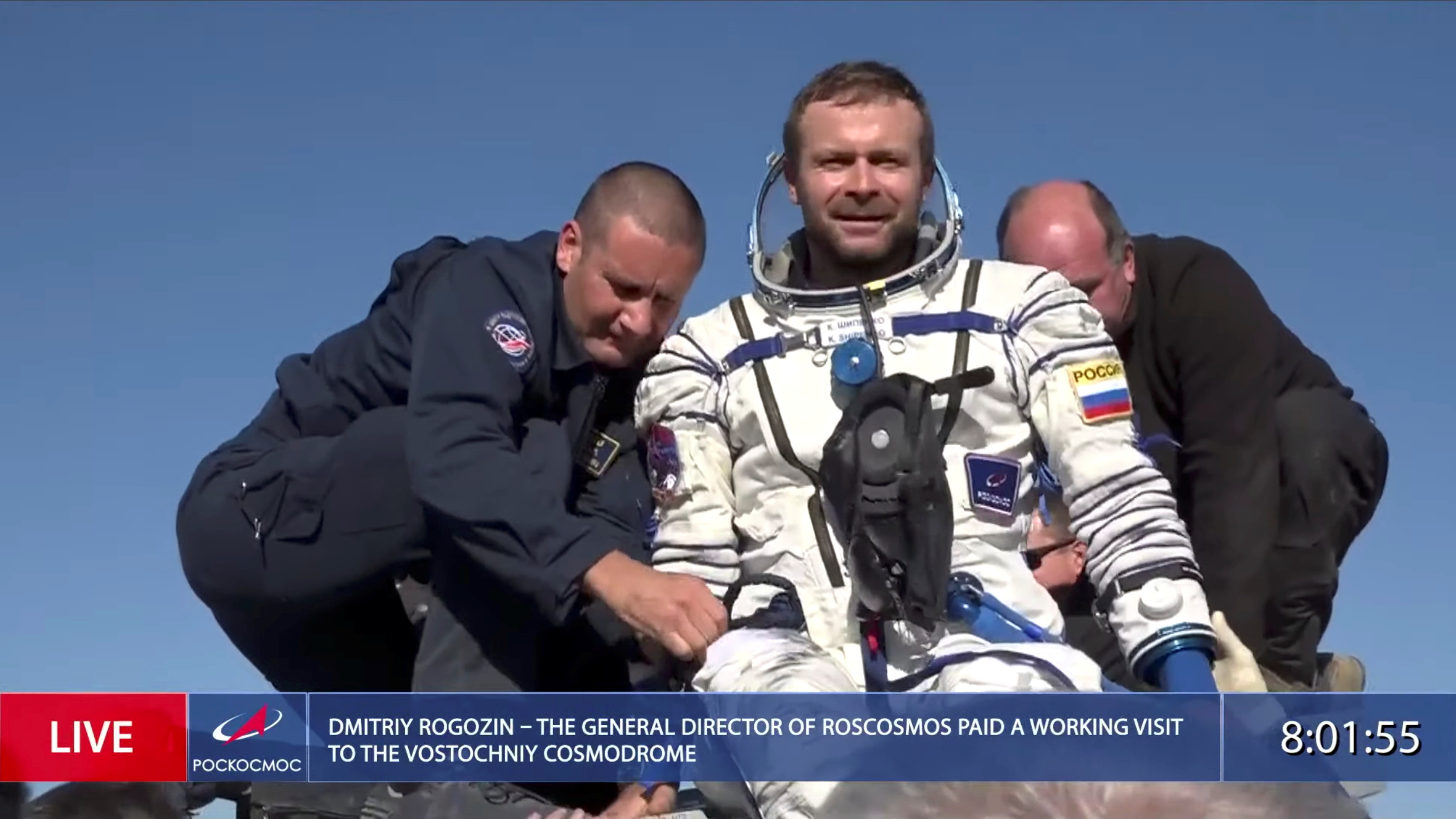 The International Space Station (ISS) crew member Russian film director Klim Shipenko is assisted by ground personnel shortly after landing [Roscosmos via Reuters]