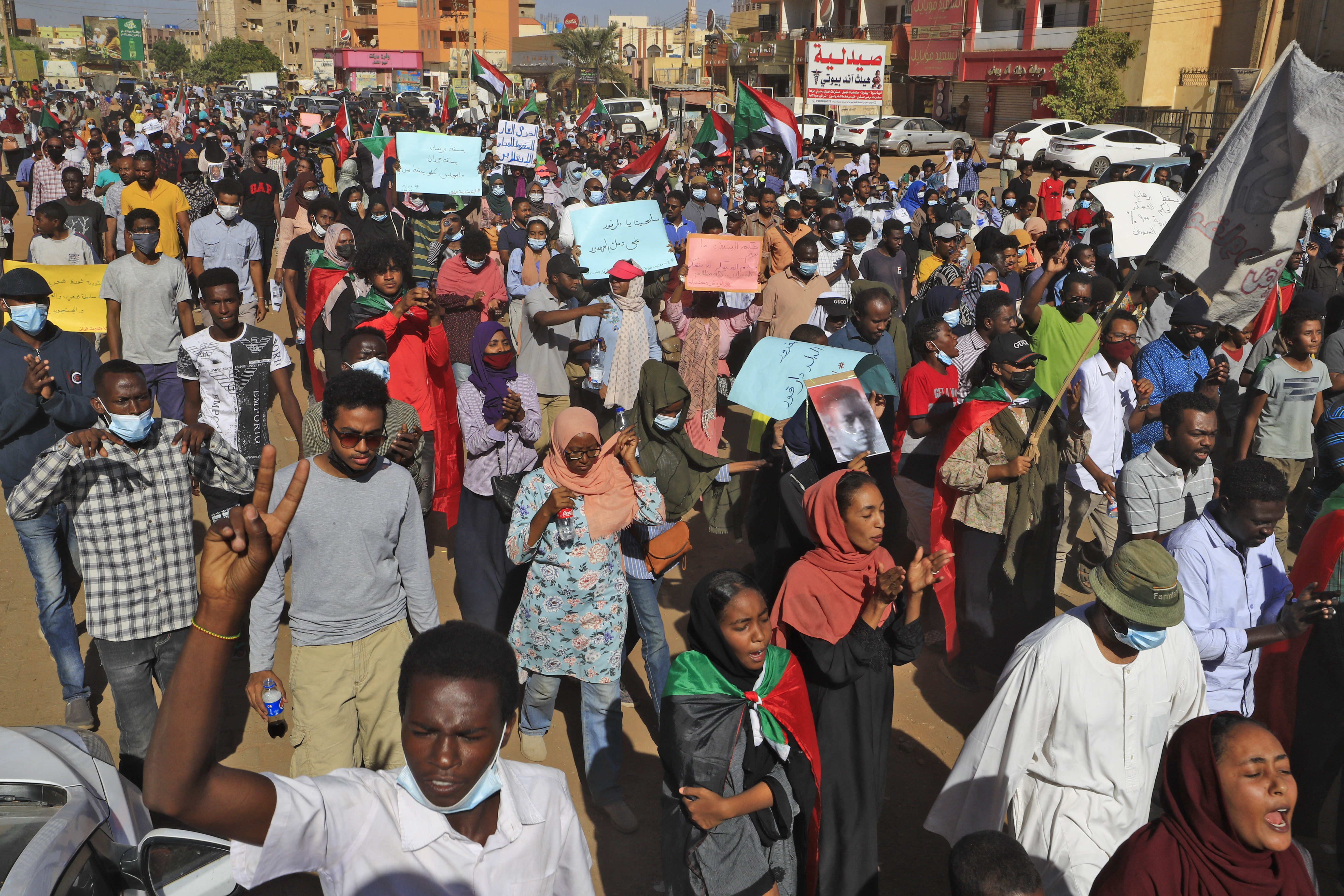Sudanese protesters demonstrate in the busy Jabra district of southern Khartoum