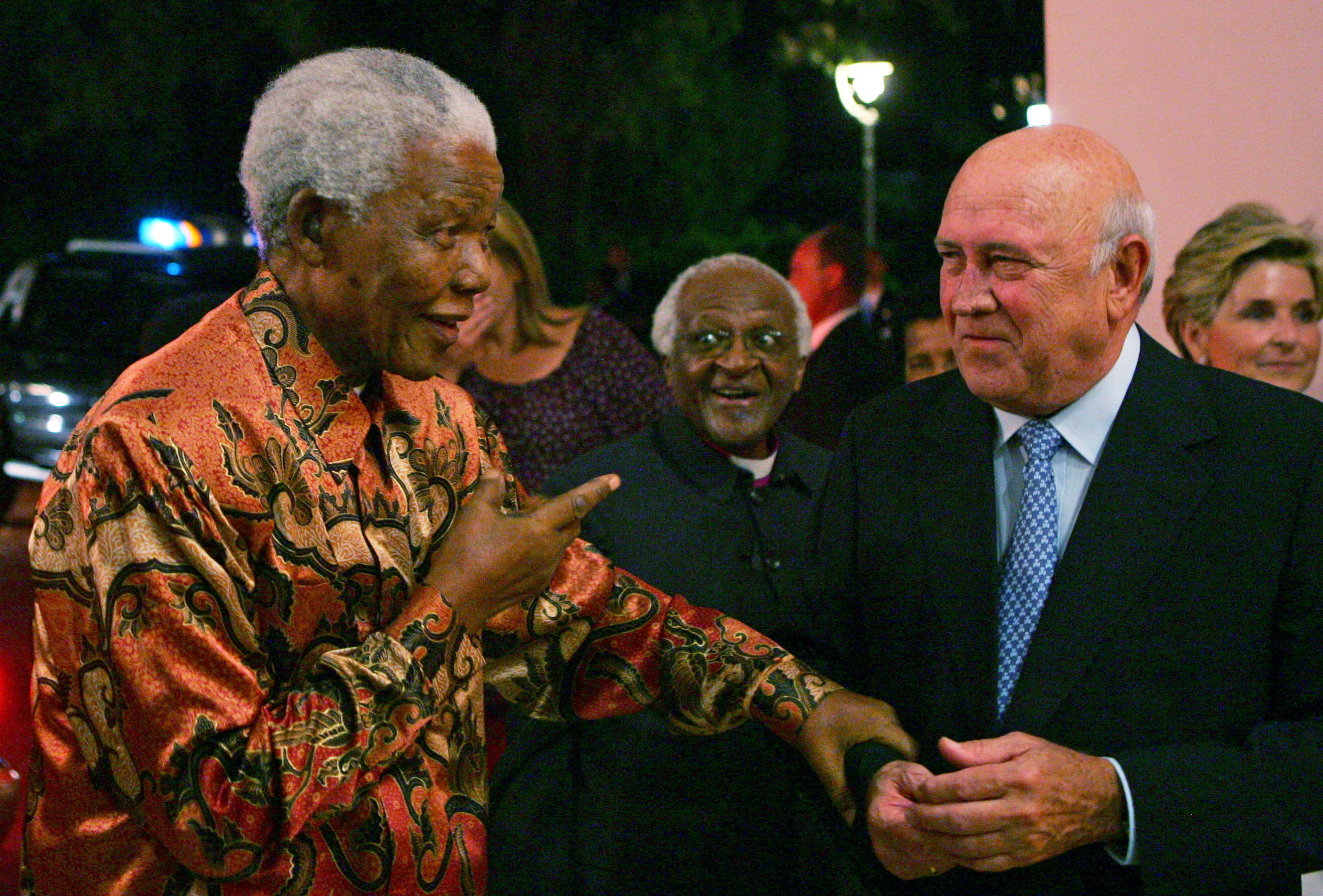 Nobel laureates Nelson Mandela, left, and Archbishop Desmond Tutu, centre, arrive for the 70th birthday celebrations of fellow laureate and ex-President FW de Klerk, right, in Cape Town