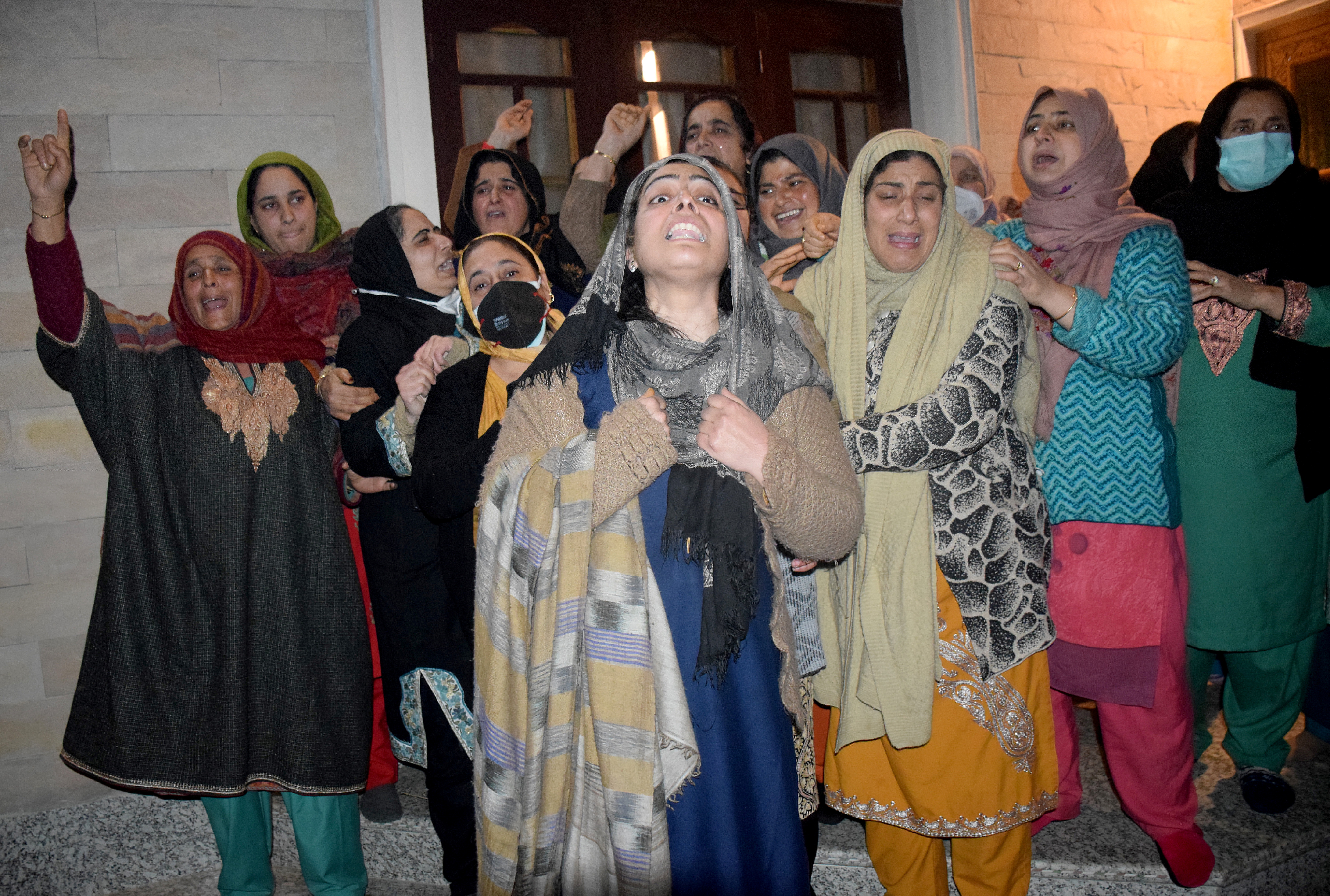 Relatives of Altaf Ahmad Bhat mourn after his body, that has been handed over by police to his relatives, was taken away for the burial in Srinagar [Reuters]