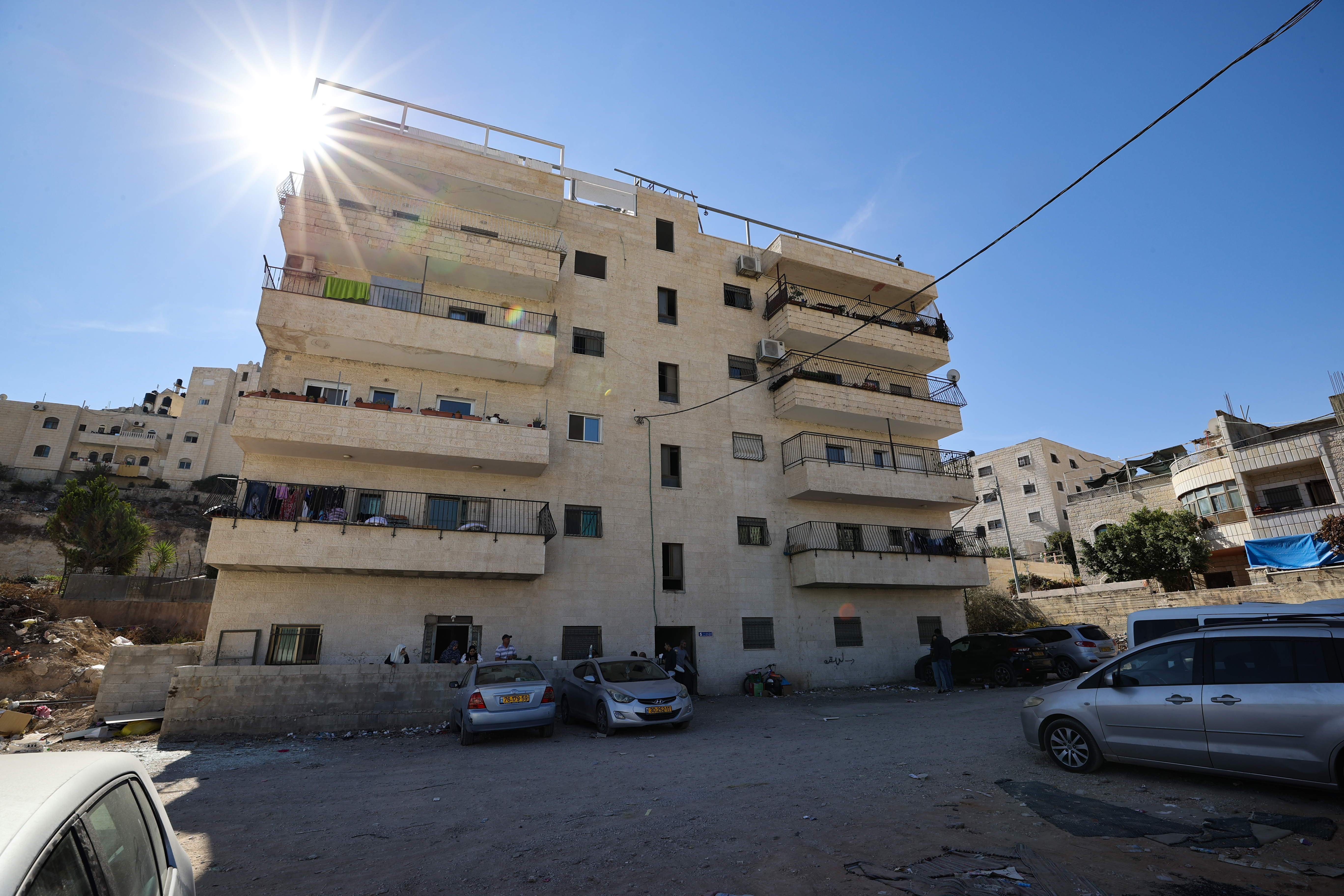 The five-storey apartment building at risk of demolition by Israeli authorities is home to 10 Palestinian families consisting of 70 people [Al Jazeera]
