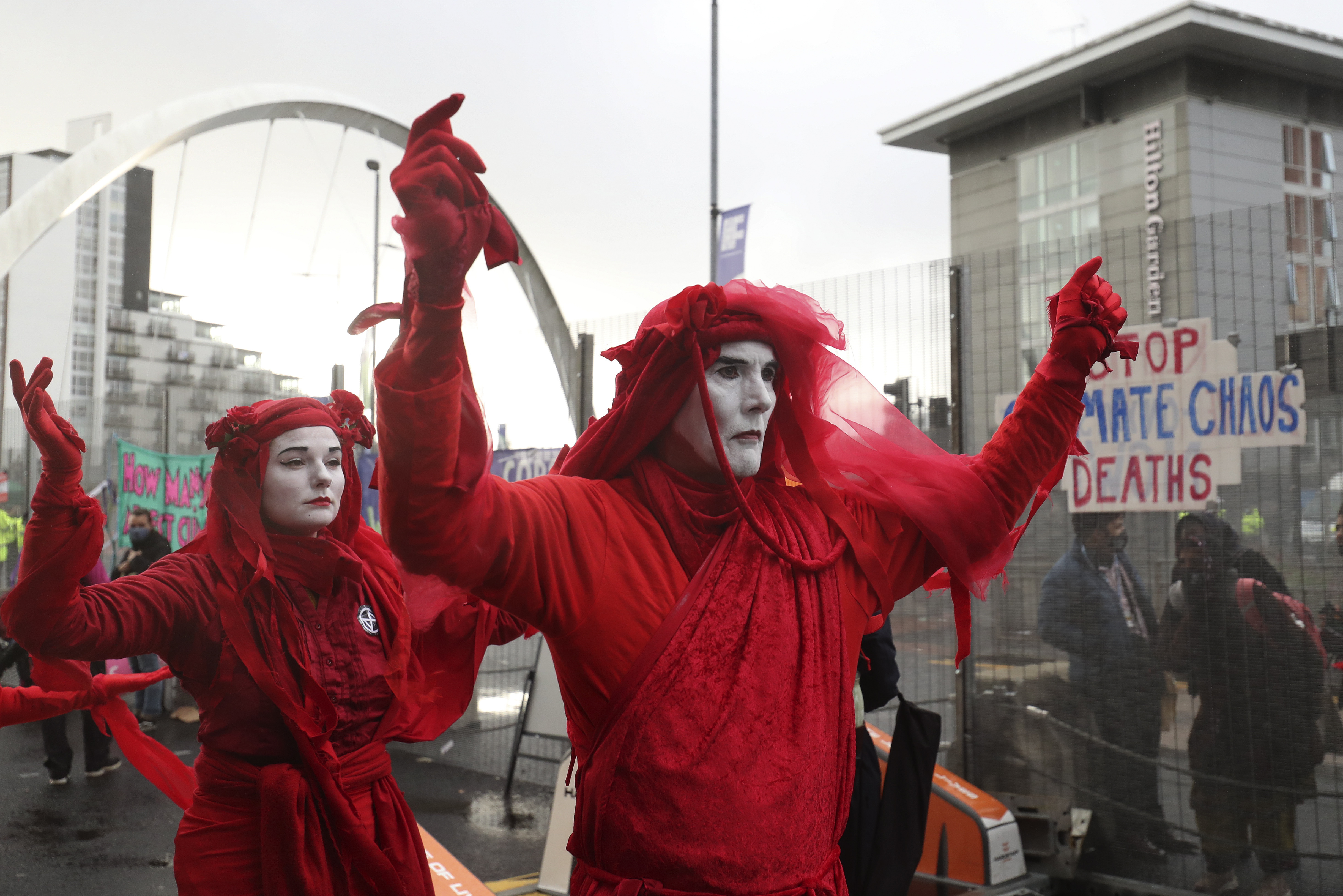 Members of Extinction Rebellion take part in a demonstration outside the venue of the COP26 UN Climate Summit in Glasgow, Scotland