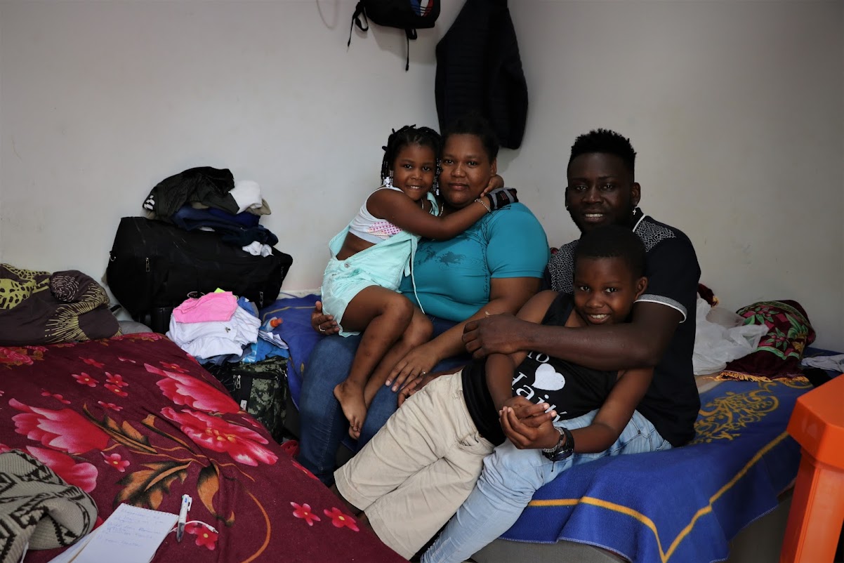 Manguenlove Bellegarde, his partner Julissa Familia and their two children in the small room they shared in Necoclí before crossing the Darien Gap