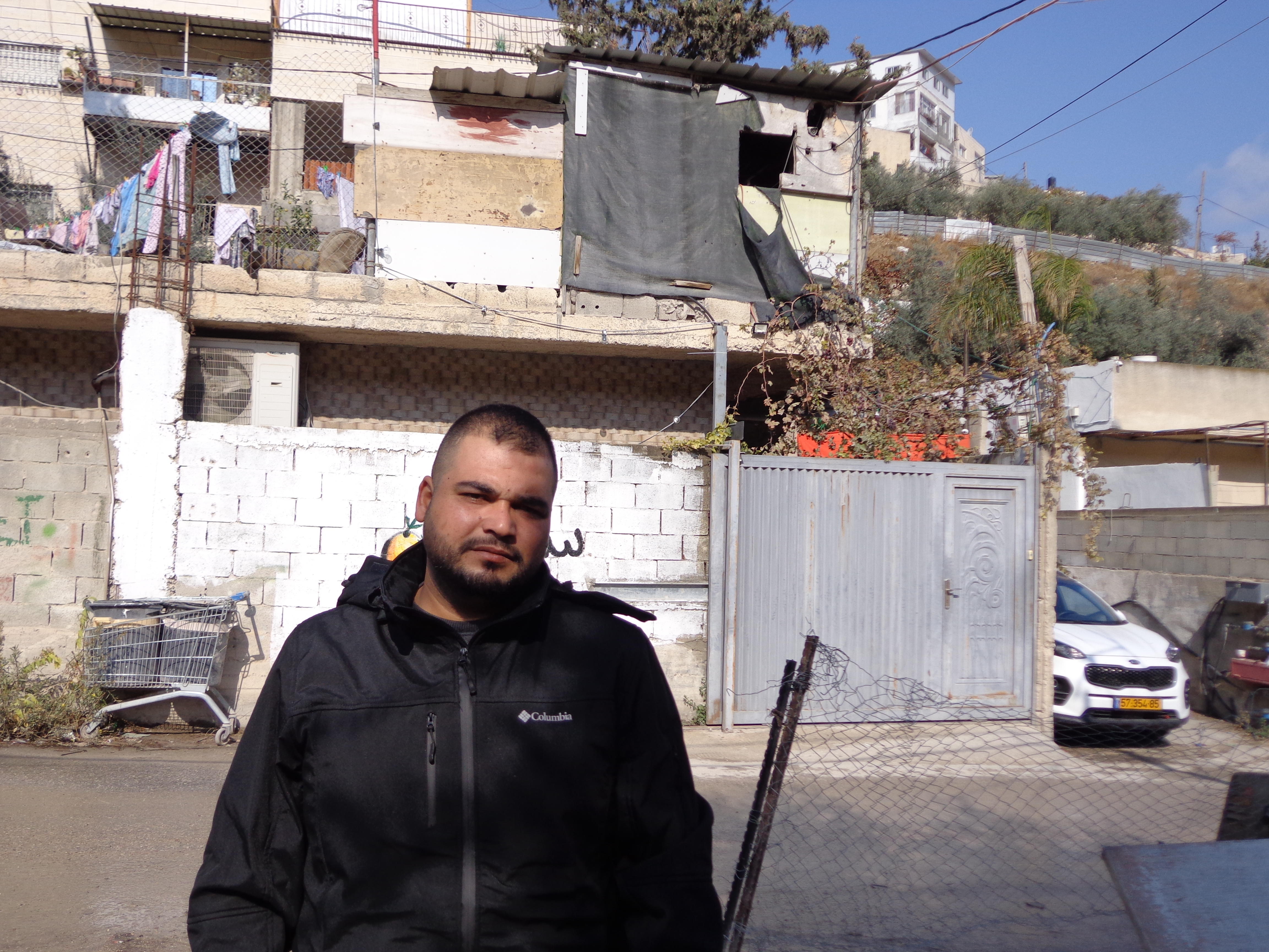 Muhammad Shweiki, 32, said 14 of his family members were being made homeless in their multi-storey home in Wadi Yasoul [Al Jazeera]