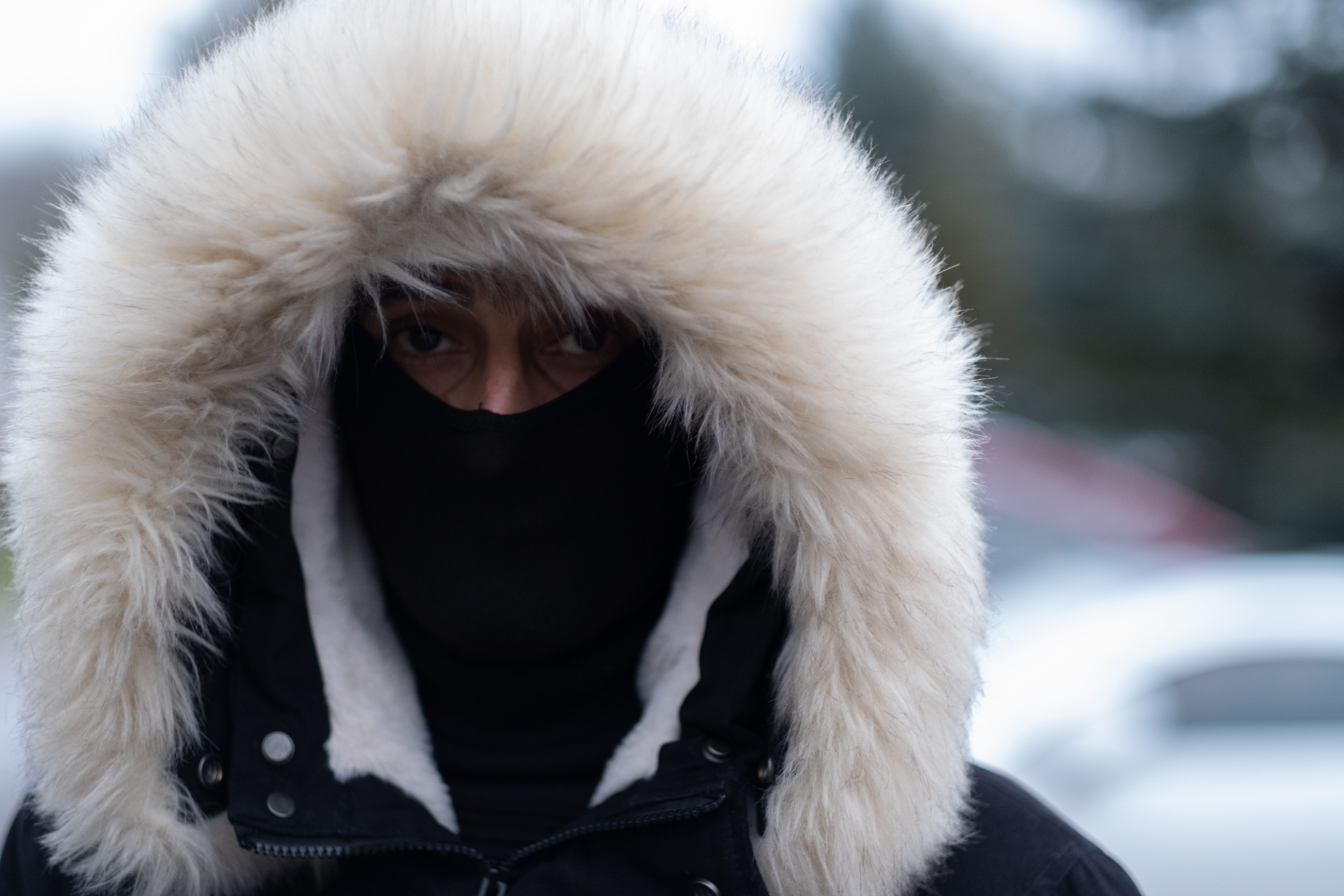 A Syrian man who now lives in Austria anxiously waits outside Hajnówka hospital to find out if his mother will be sent back to the exclusion zone in the forest