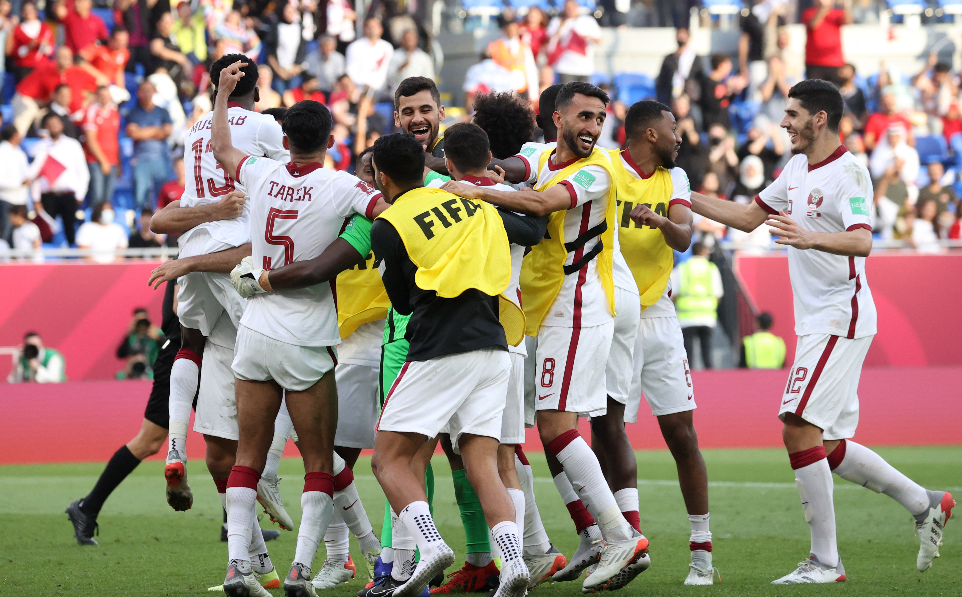 Qatar celebrate beating Egpyt on penalties to claim third place in the Arab World Cup
