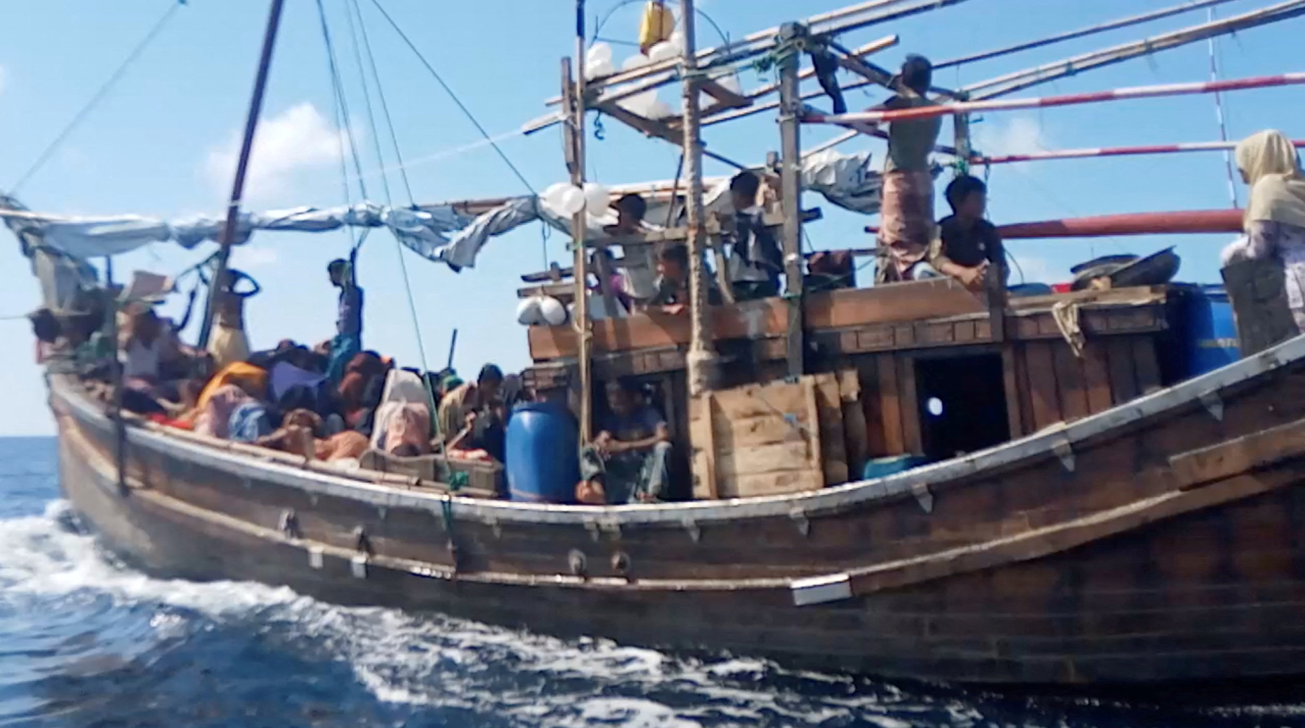 A boat carries Rohingya people stranded at sea, Indonesia,