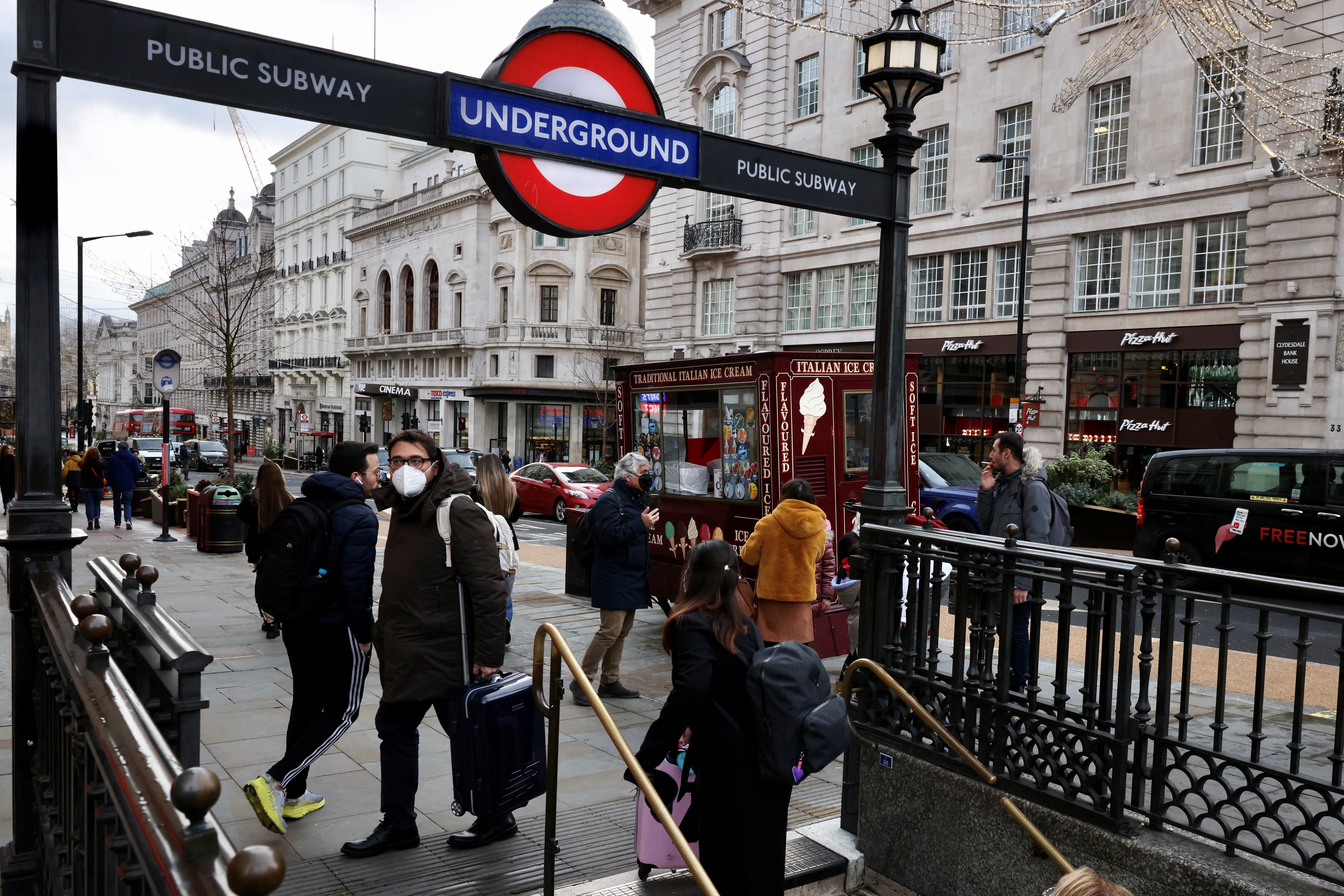 People arrive at Piccadilly amid the coronavirus disease (COVID-19) outbreak, in London, Britain