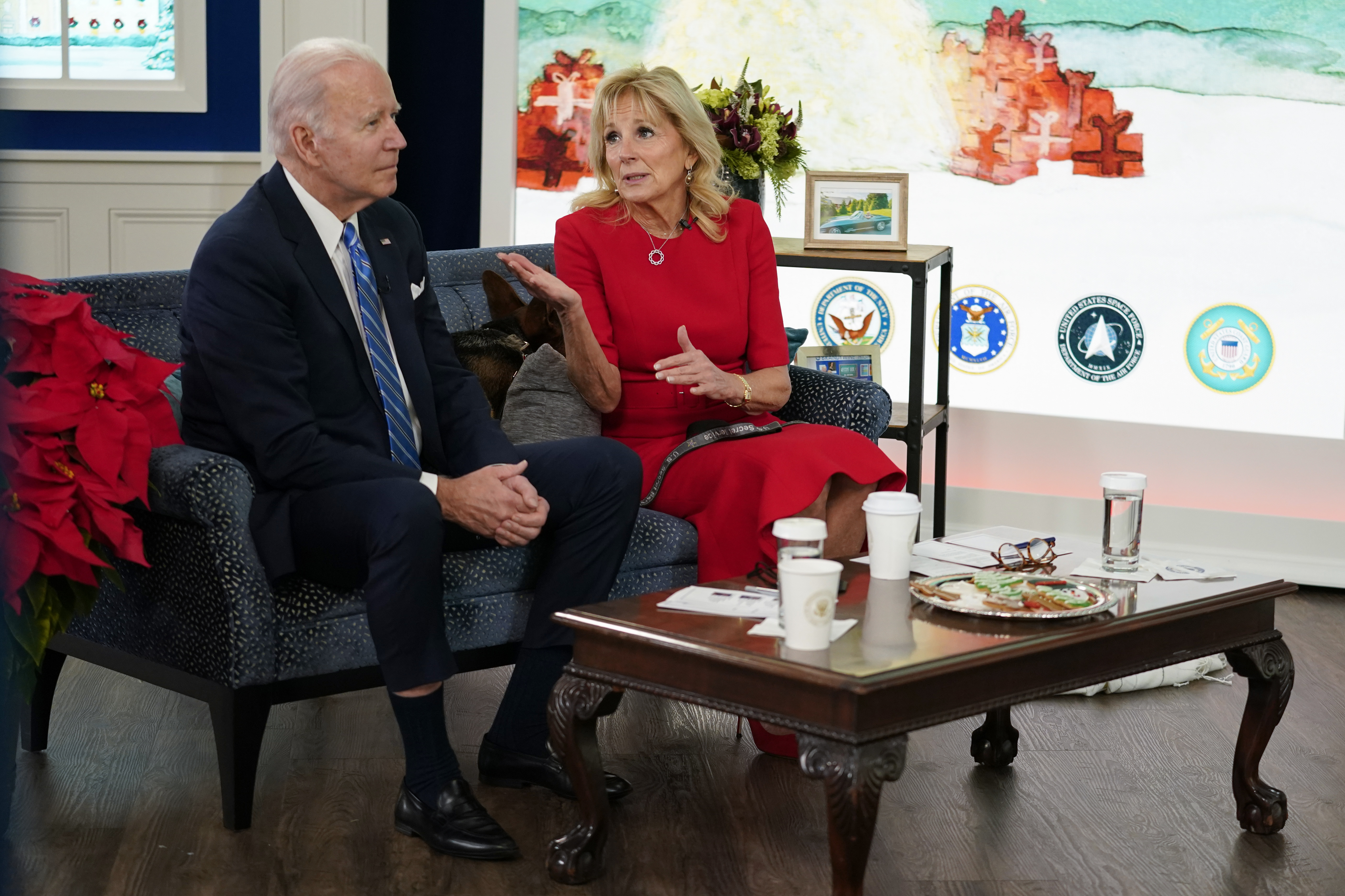 President Joe Biden, First Lady Jill Biden and their new dog Commander meet virtually with service members around the world, Saturday, December 25, 2021