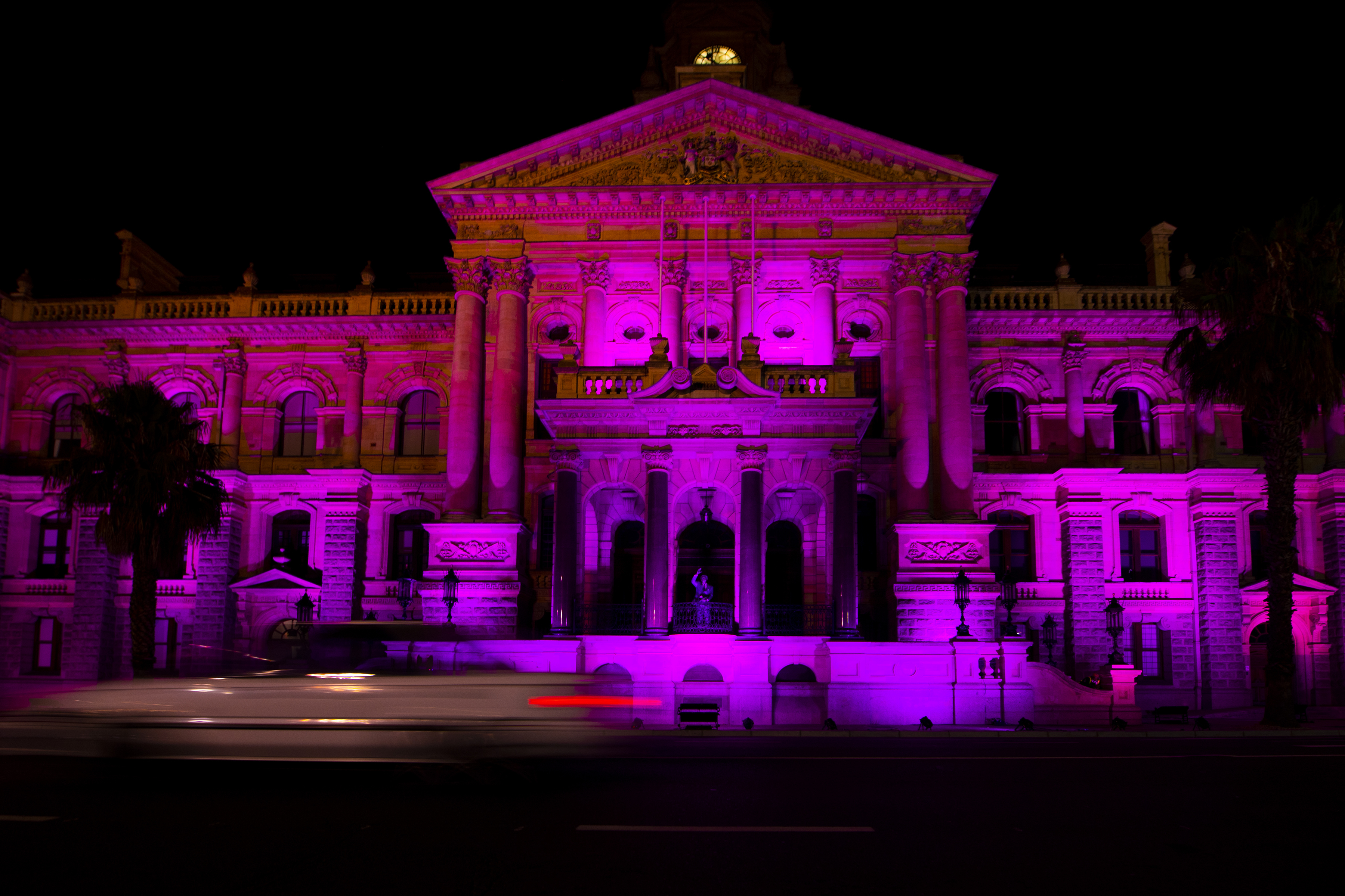 Cape Town City Hall is lit up in purple in memory of Anglican Archbishop Desmond Tutu. [AP Photo]