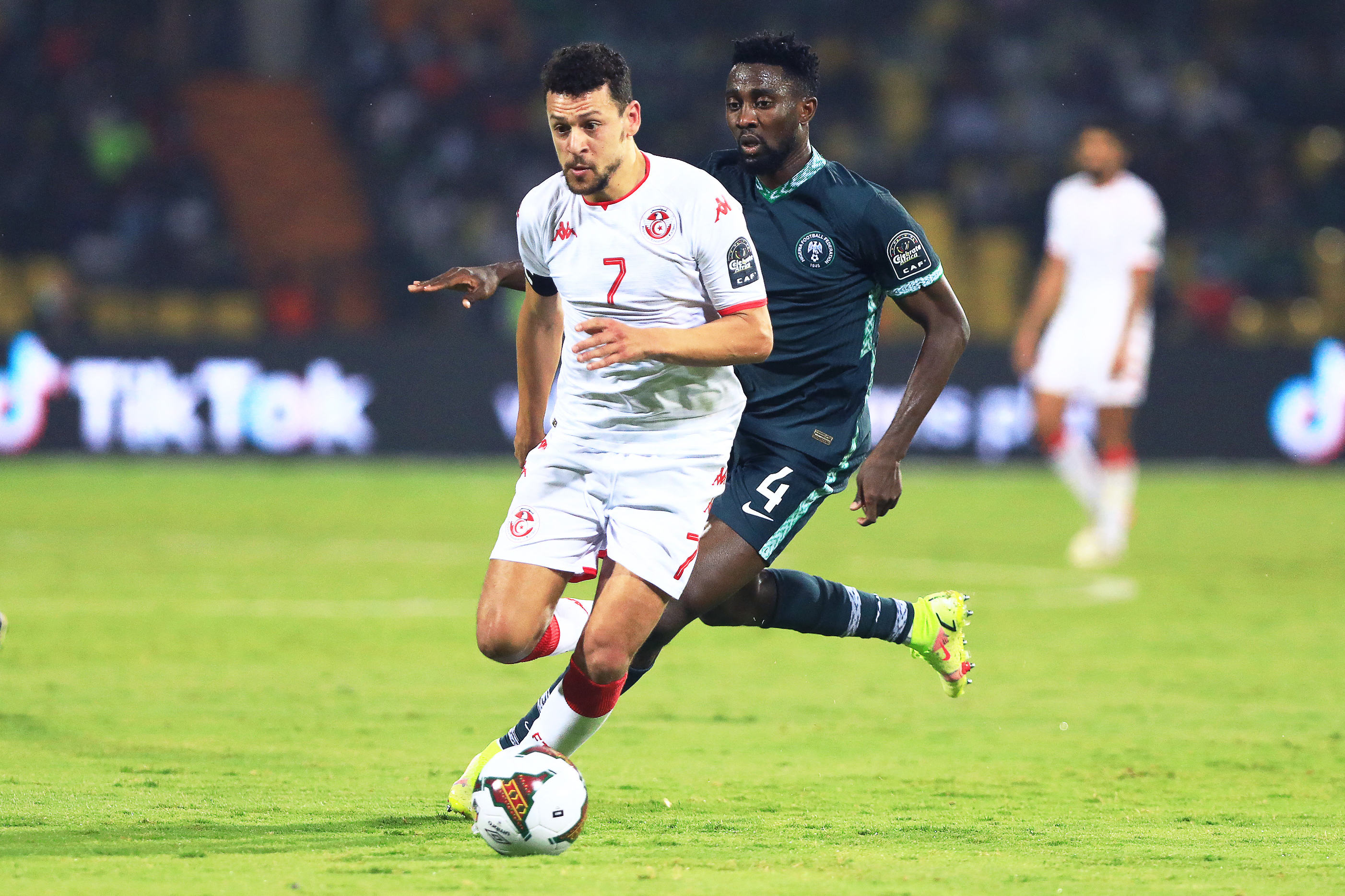 Tunisia’s forward Youssef Msakni (L) fights for the ball with Nigeria’s midfielder Wilfred Ndidi during the Africa Cup of Nations 2021 round of 16 football match