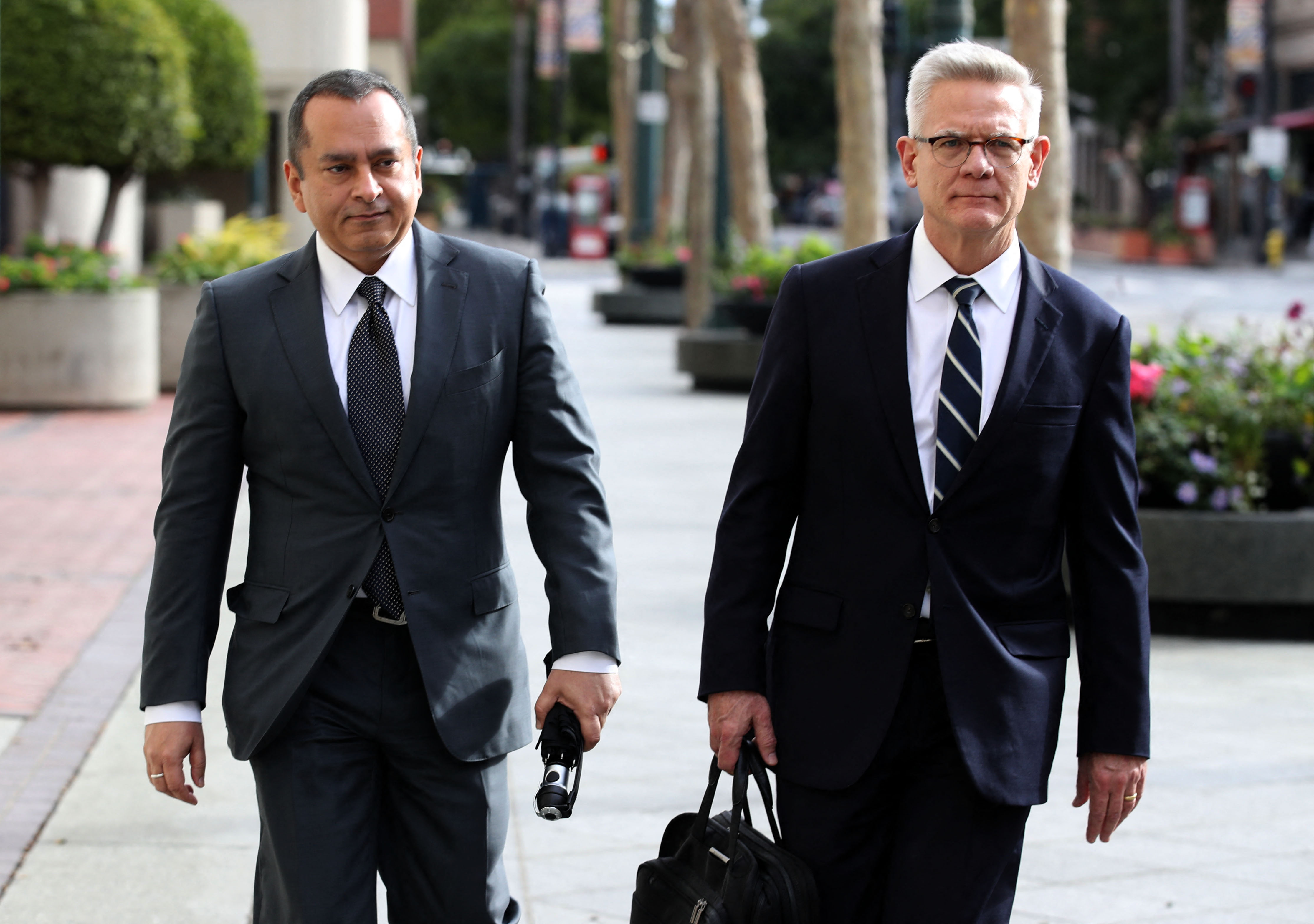 Former Theranos COO Ramesh Balwani (left) also faces charges of fraud. He and Holmes were once a couple