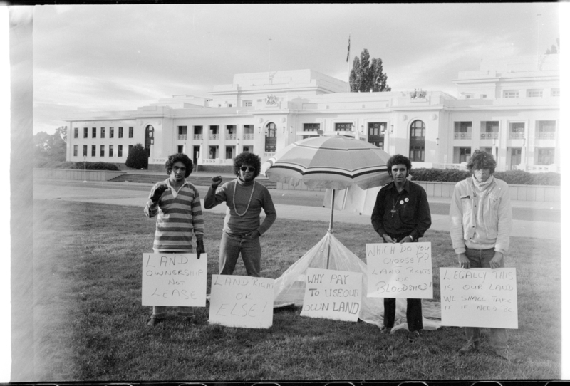The first day of the Aboriginal Embassy on January 27, 1972. Left to right: Billy Craigie, Bert Williams, Michael Anderson, and Tony Coorey