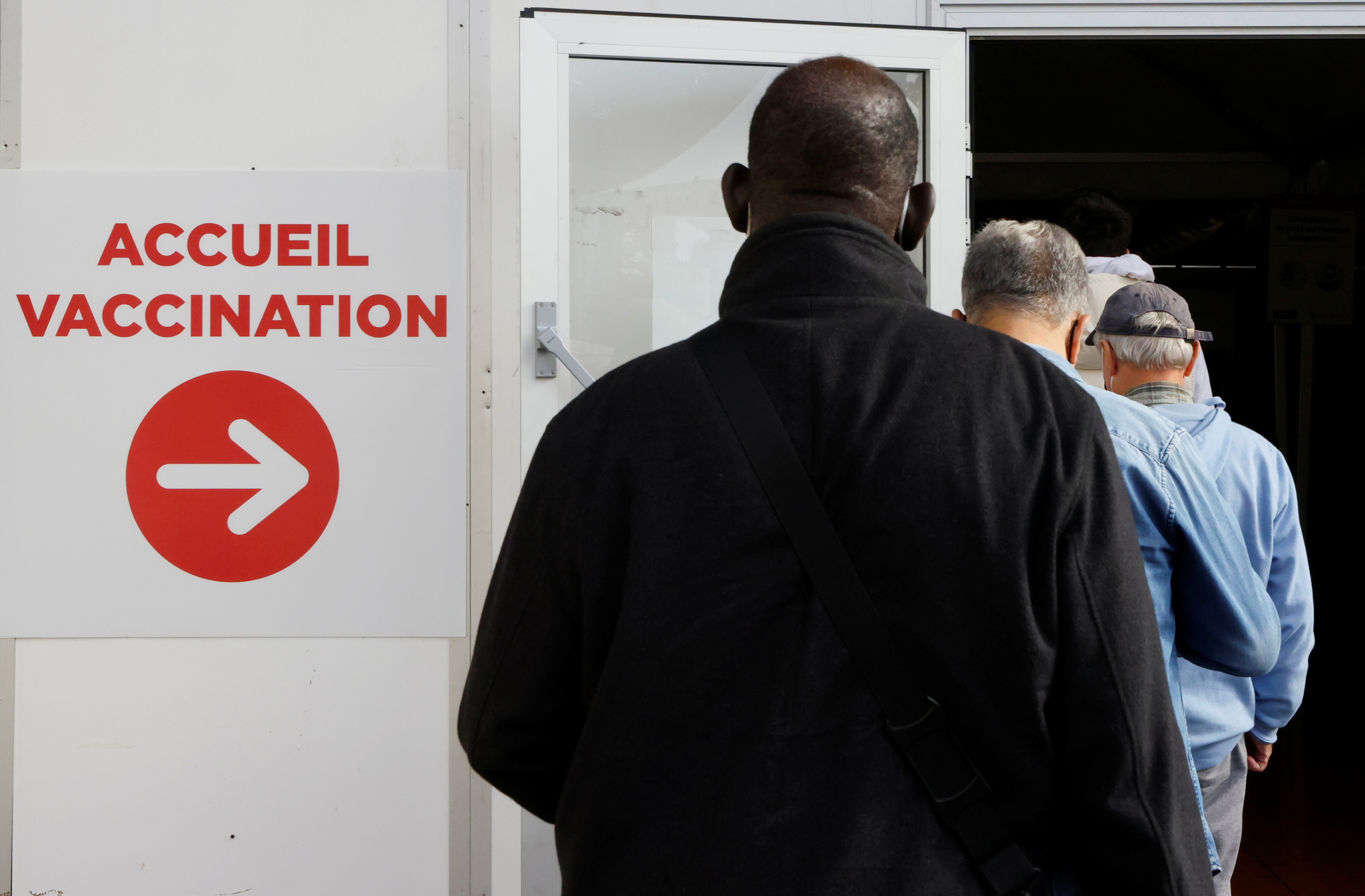 People line up at a COVID-19 vaccination centre in Nice, France