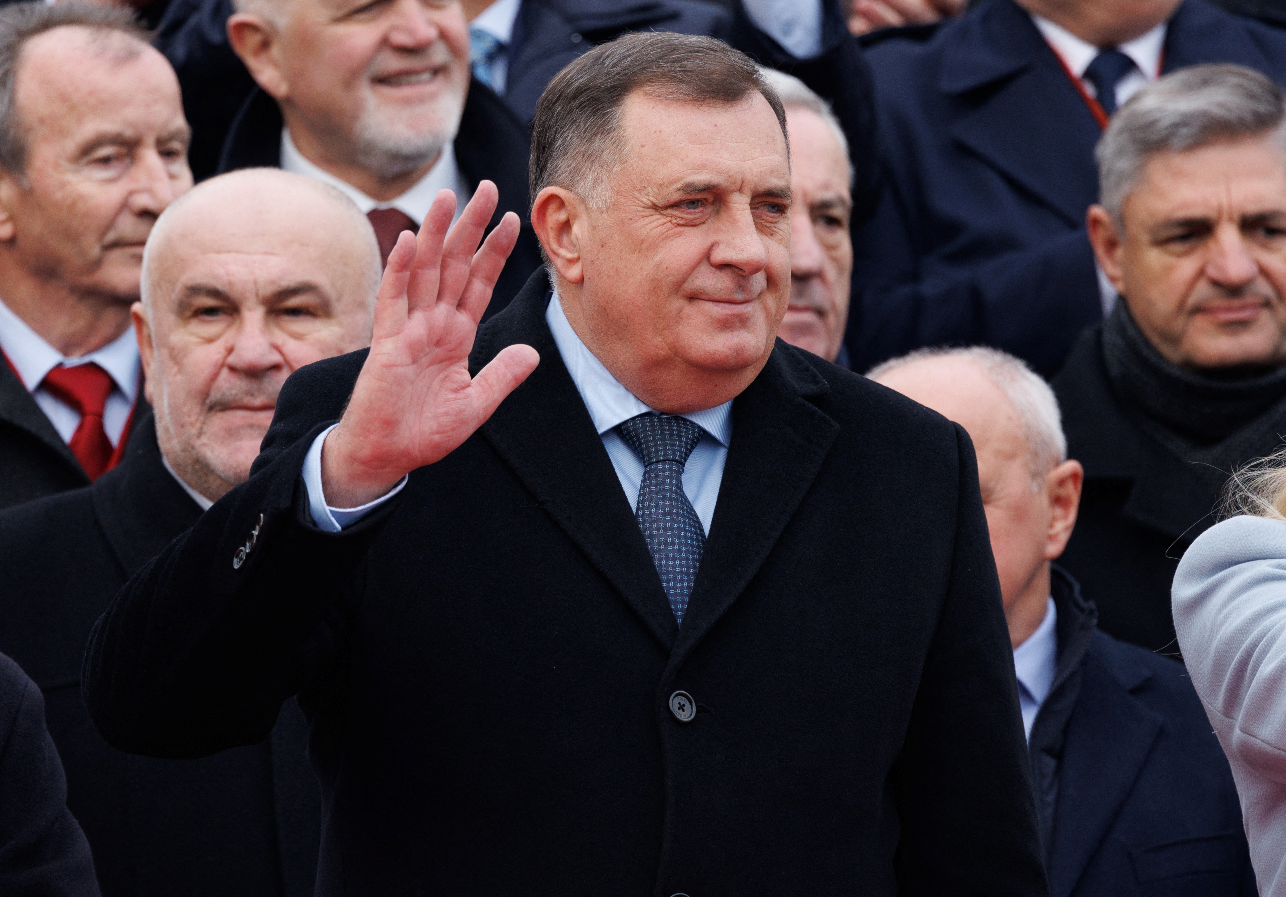 Bosnia’s member of tripartite presidency Milorad Dodik waves to people during a parade to mark their autonomous Serb Republic’s national holiday