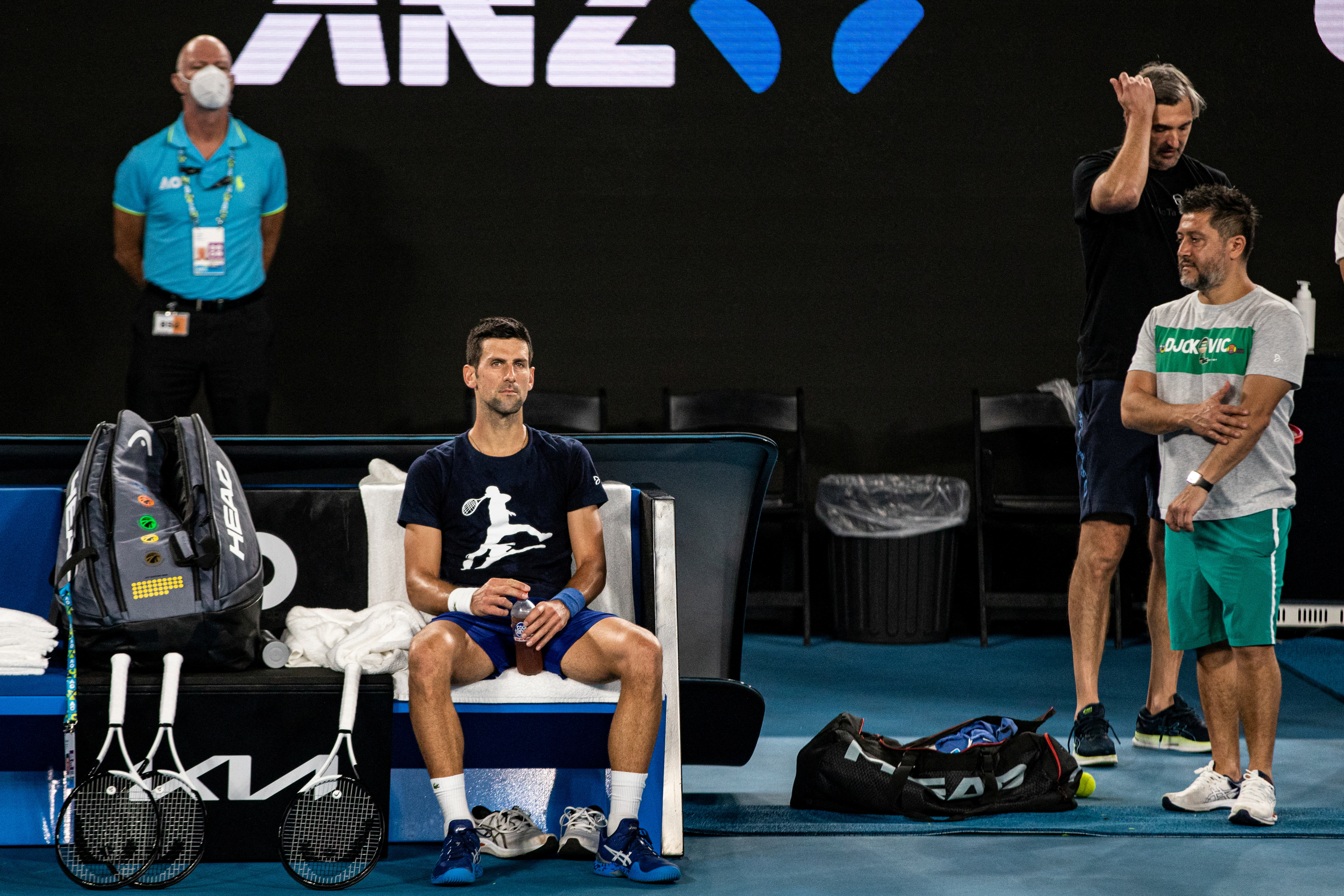 Djokovic rests during a training session at Melbourne Park