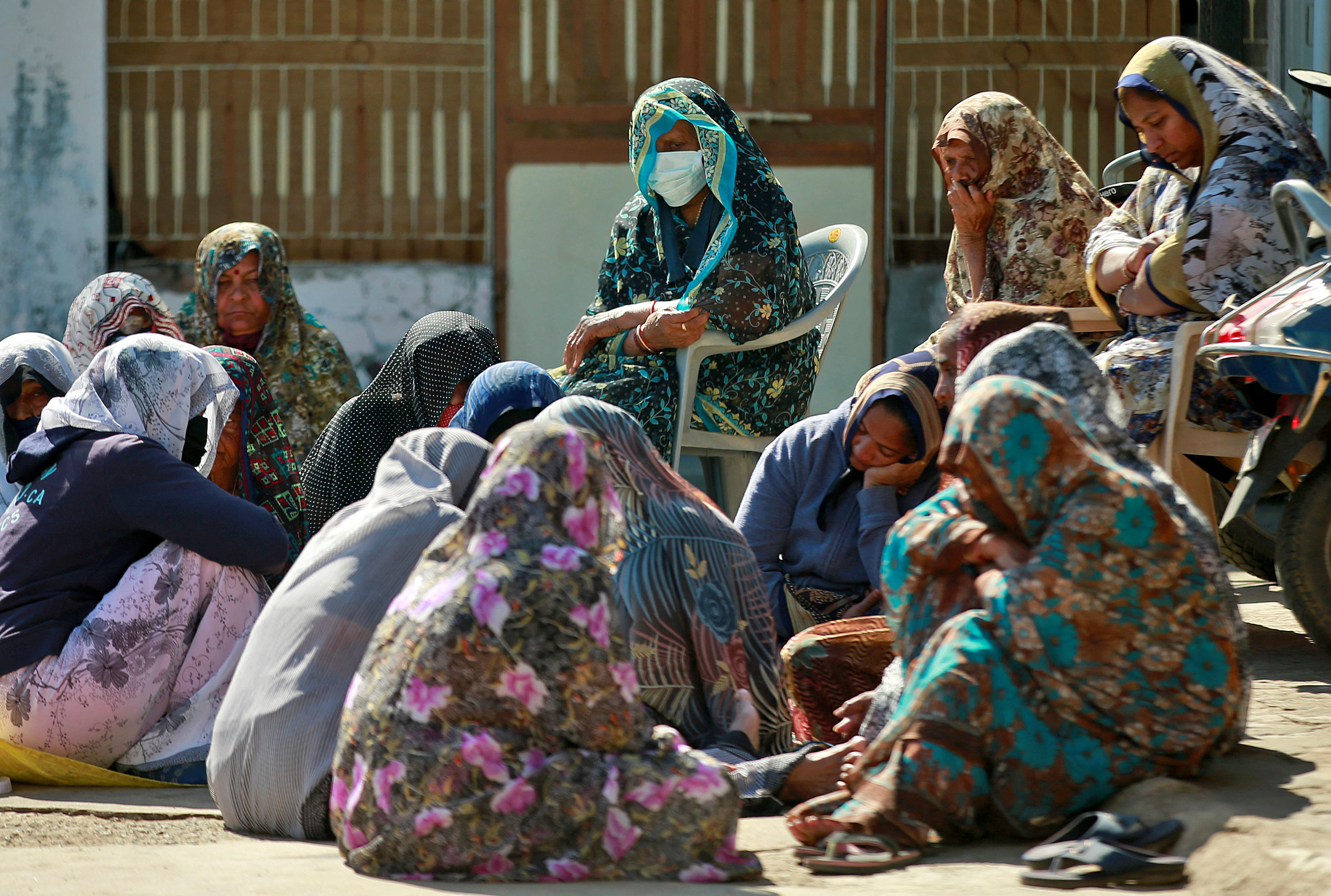Relatives of Jagdish Baldevbhai Patel, who along with his wife and their two children froze to death near the Canada-US border, gather to mourn the deaths at Dingucha village, Gujarat
