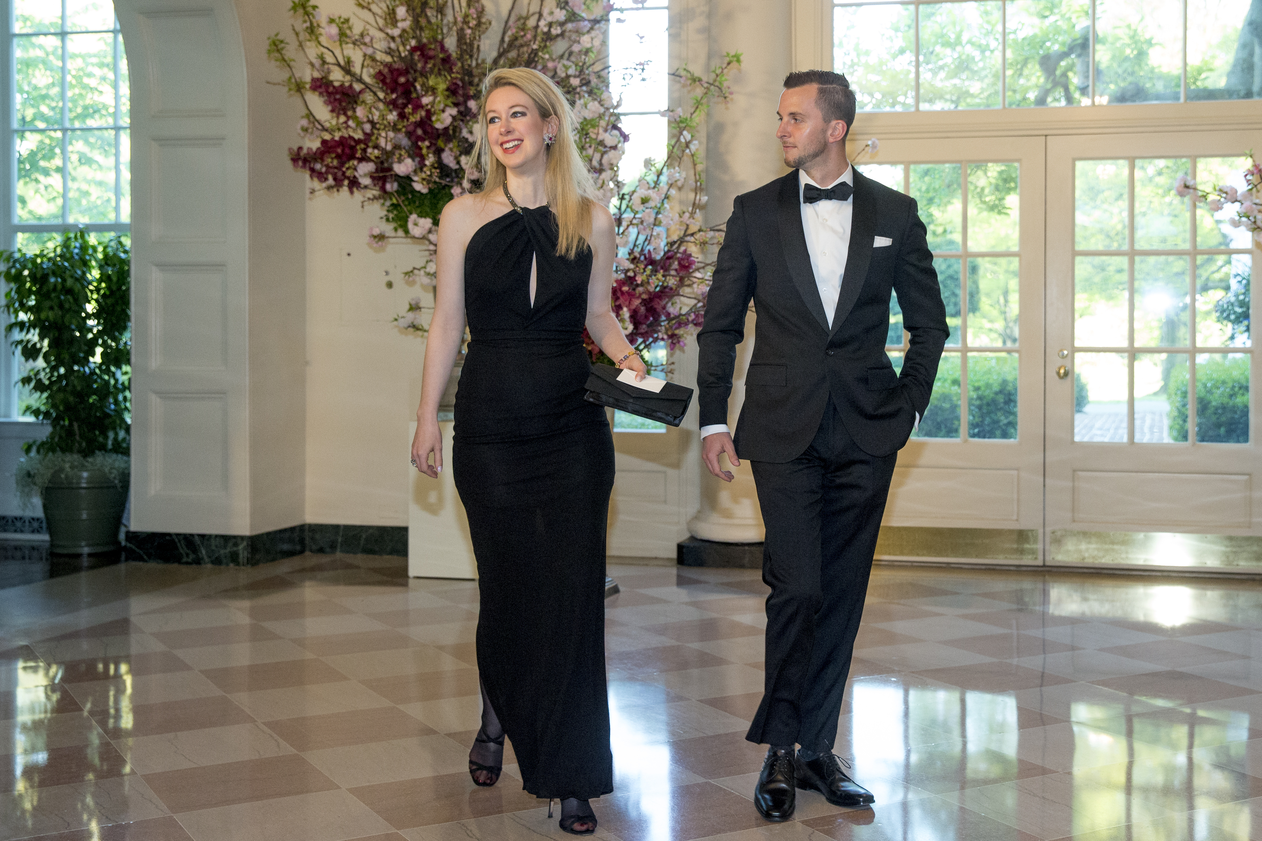Theranos’s Elizabeth Holmes and Christian Holmes arrive for a state dinner for Japanese Prime Minister Shinzo Abe in April 2015, a few months before the Wall Street Journal published a bombshell report on her company’s business