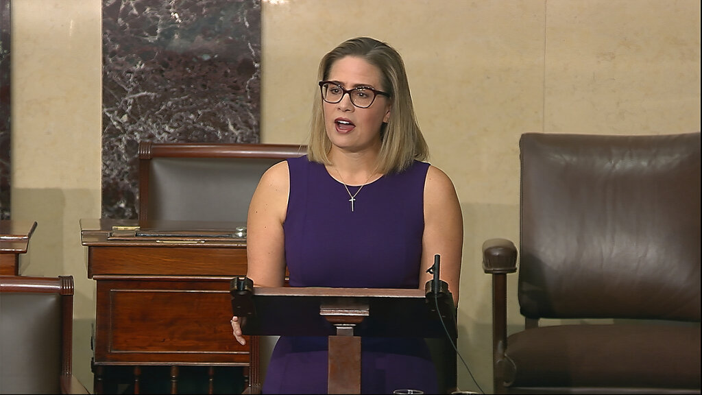 Senator Kyrsten Sinema, a Democrat from Arizona, blunted the chances of voting rights legislation when she declared she could not support a “short sighted” rules change to get past a Republican blockade. [Senate Television via AP]