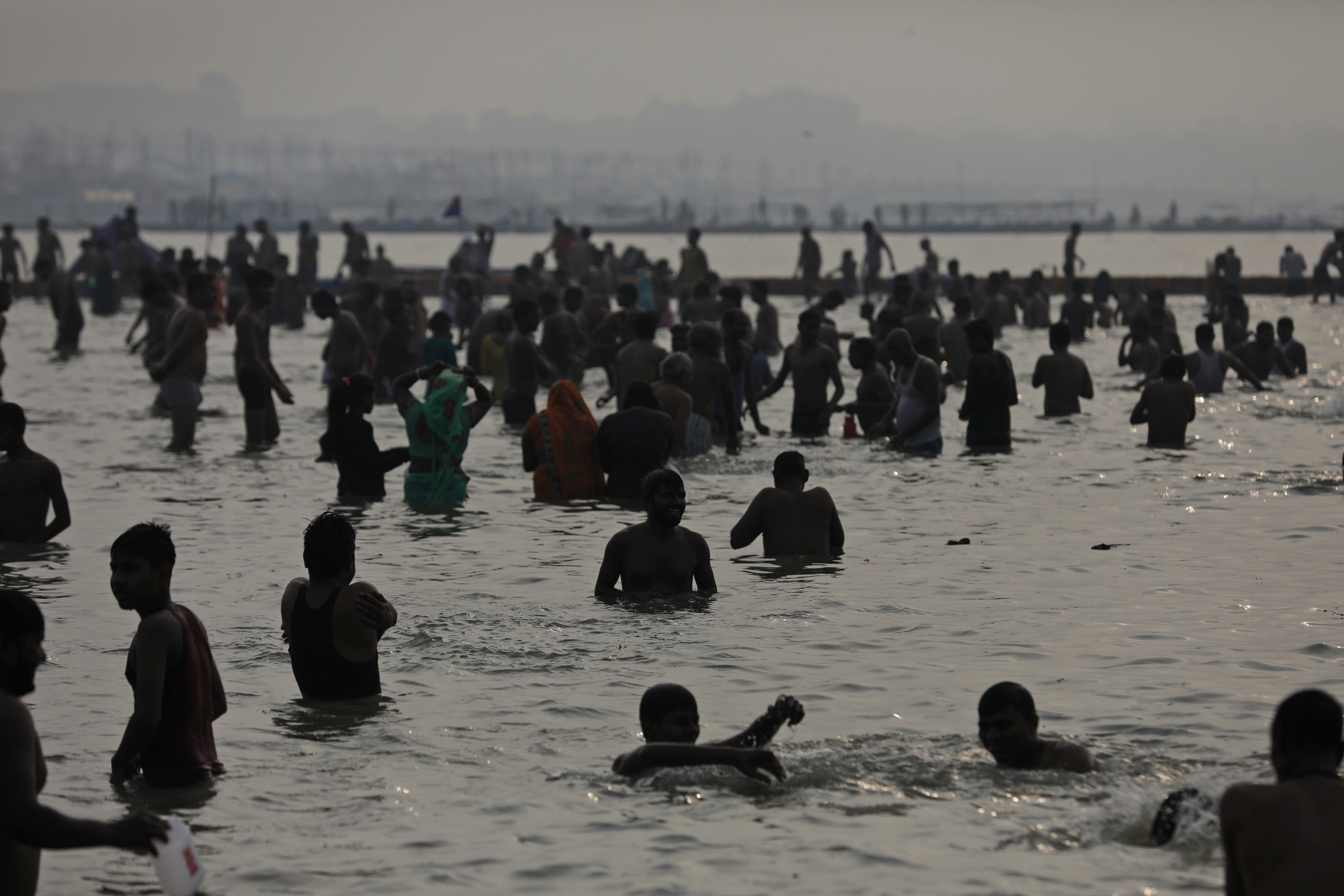 The event has raised concerns that pilgrims could get infected and take the virus back to their cities and villages in other parts of the country. as Hindu devotees bathe in the Sangam