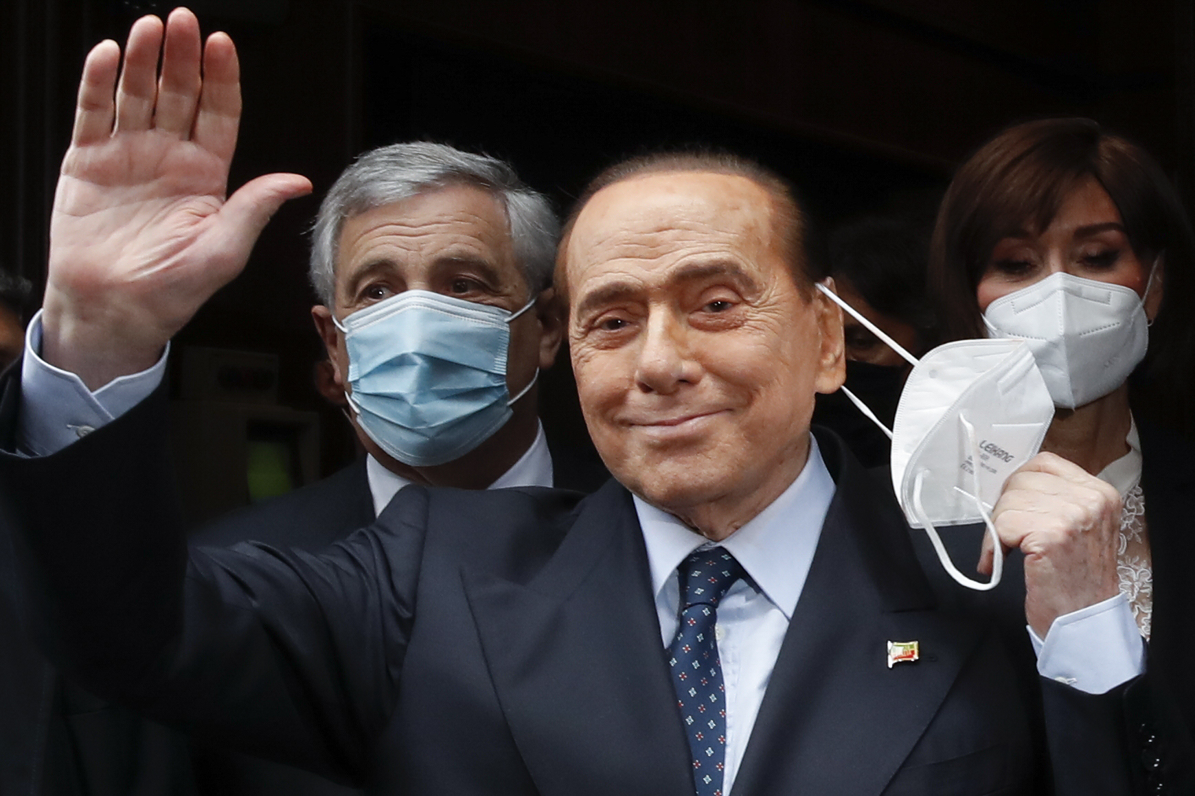 Former Italian Premier Silvio Berlusconi waves