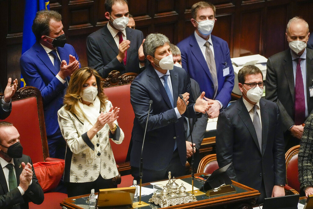 President of the Senate Maria Elisabetta Alberti Casellati, left, and low Chamber President Roberto Fico clap their hands after Sergio Mattarella is re-elected as Italy’s 13th president