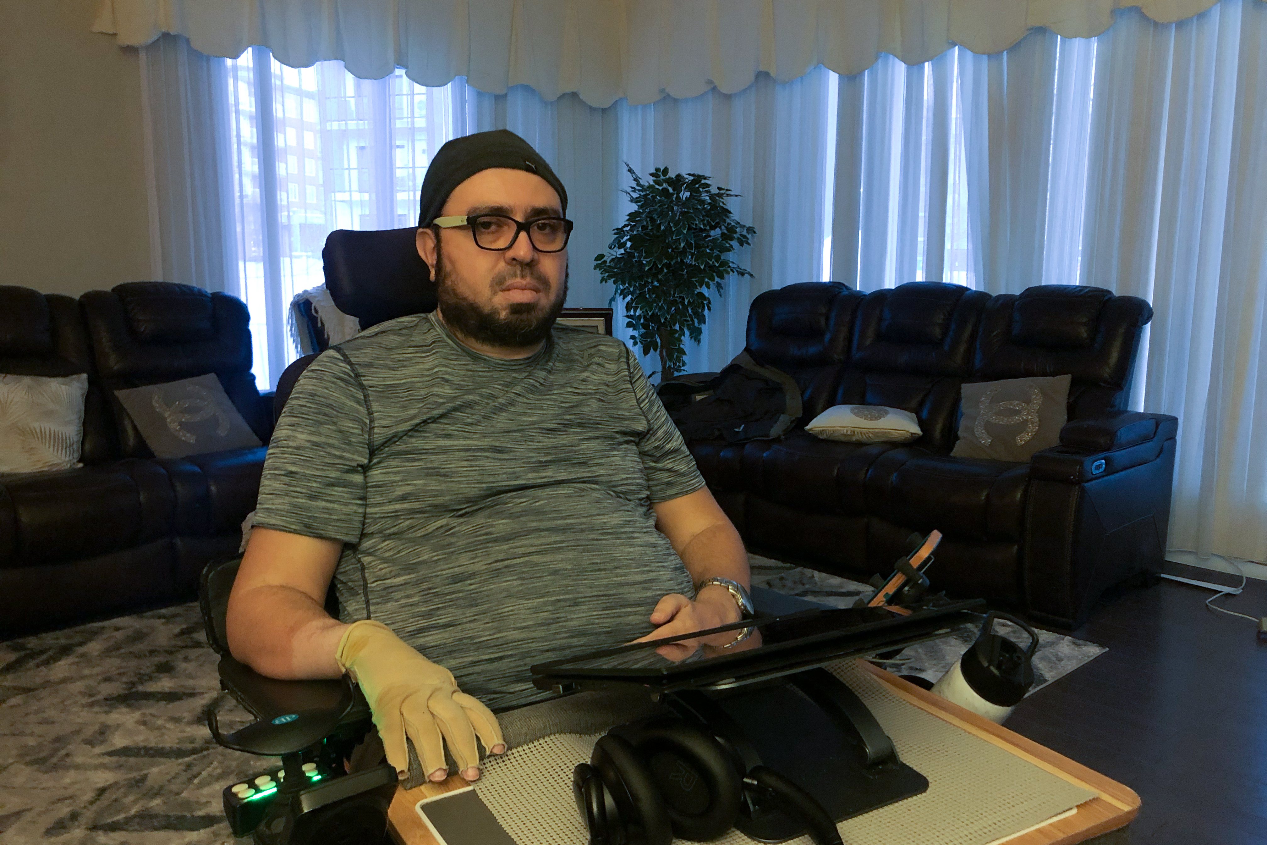 Aymen Derbali poses for a photo at his home in Quebec City, Canada