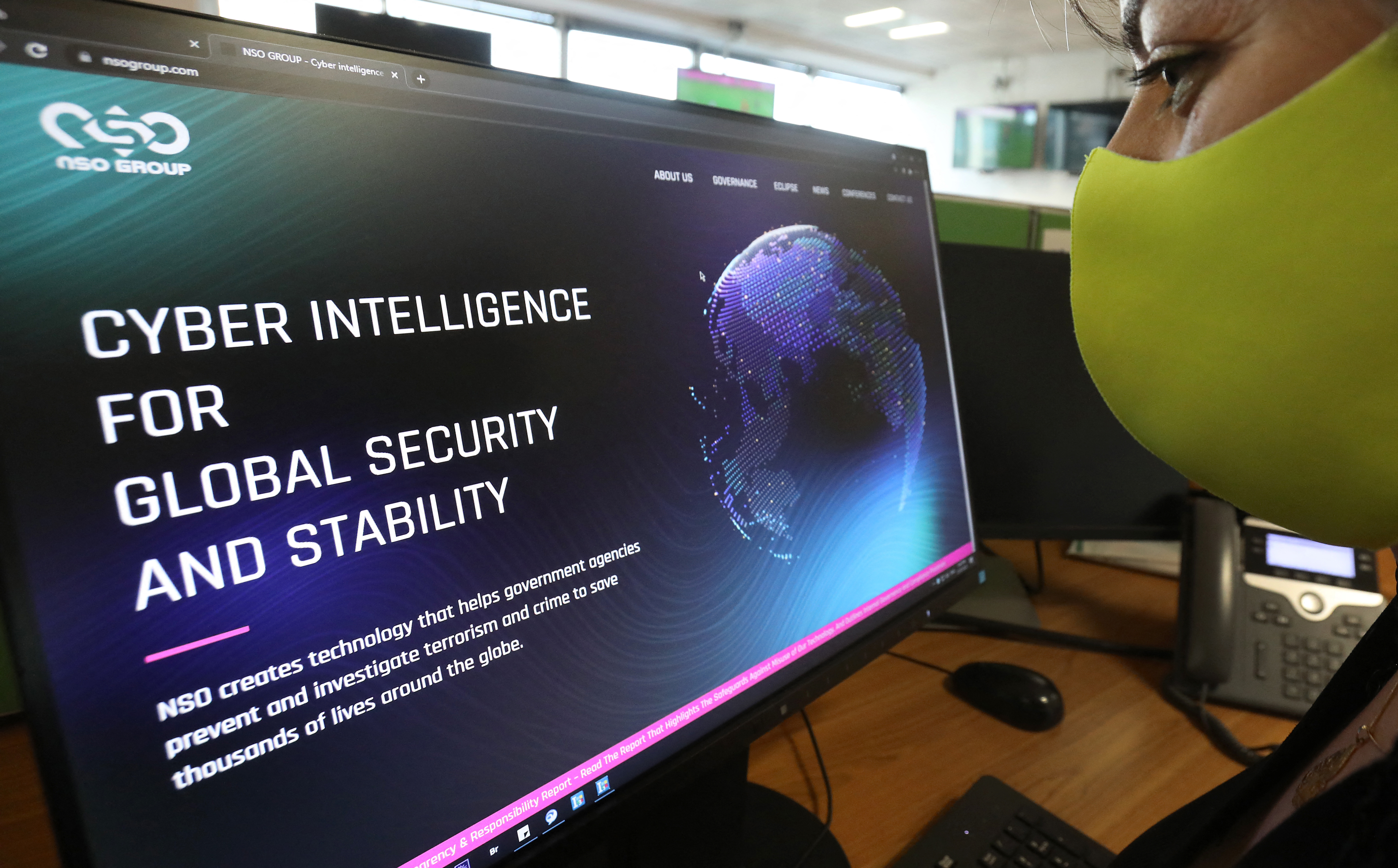 A woman checks the website of Israel-made Pegasus spyware at an office in the Cypriot capital Nicosia