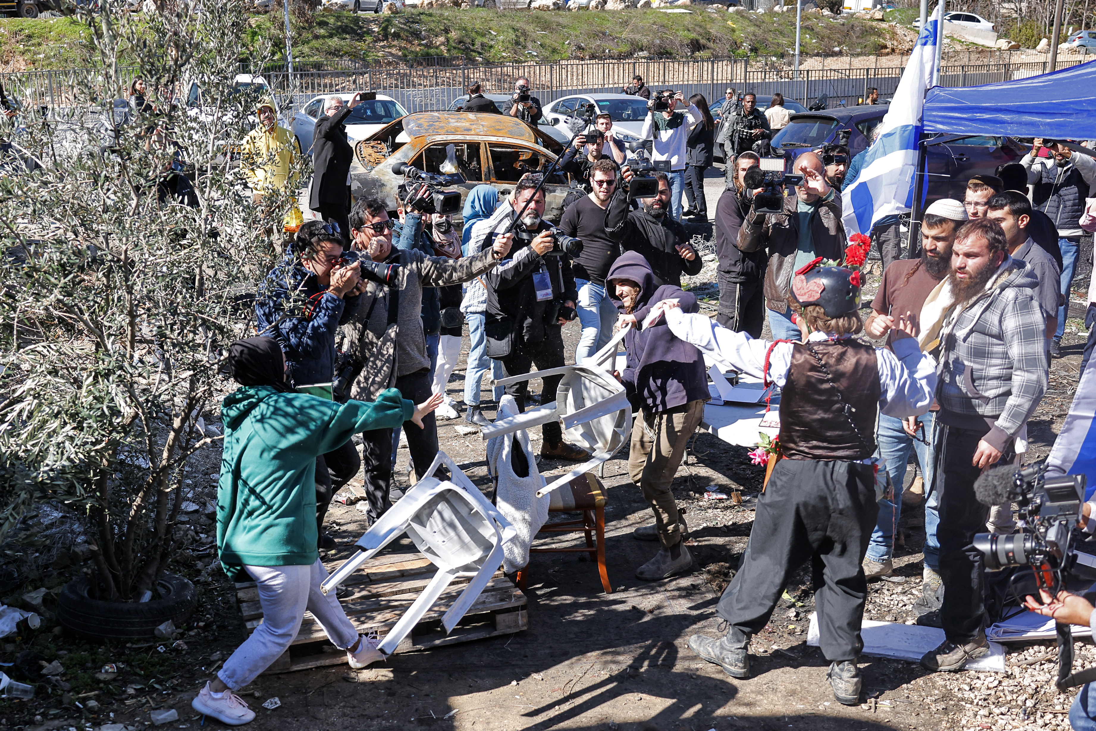 Israeli settlers clash with Palestinians in the East Jerusalem neighborhood of Sheikh Jarrah