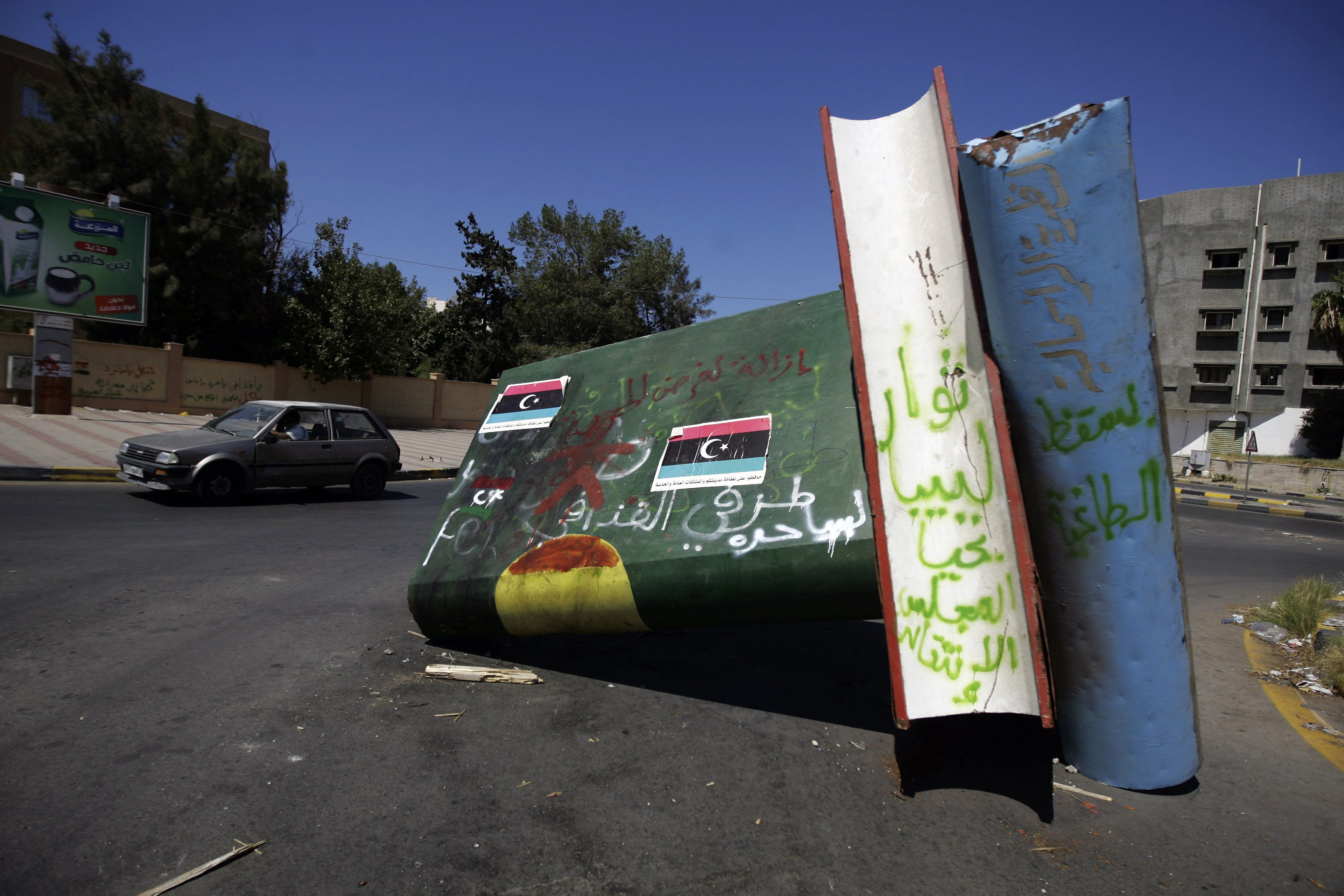 A turned down monument representing Gaddafi’s ‘Green Book’ in the Libyan capital Tripoli on September 10, 2011. The Green Book is a collection of Gaddafi’s political thoughts, social and economic theories that are said to have been his attempt to replicate chairman Mao’s ‘Little Red Book’