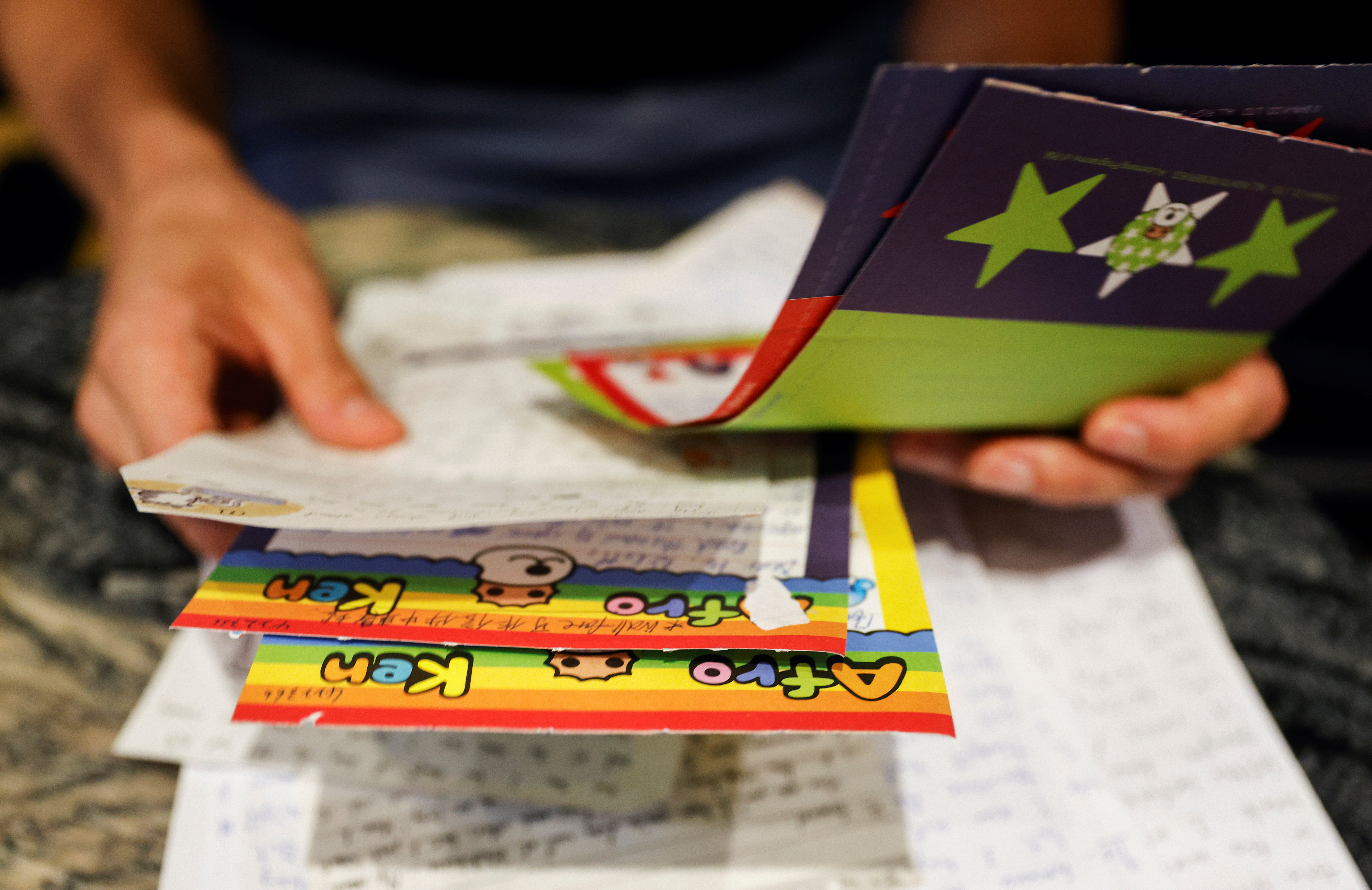 Samuel Bickett leafs through some of the colourful letters he received when he was in prison before being granted bail for his appeal