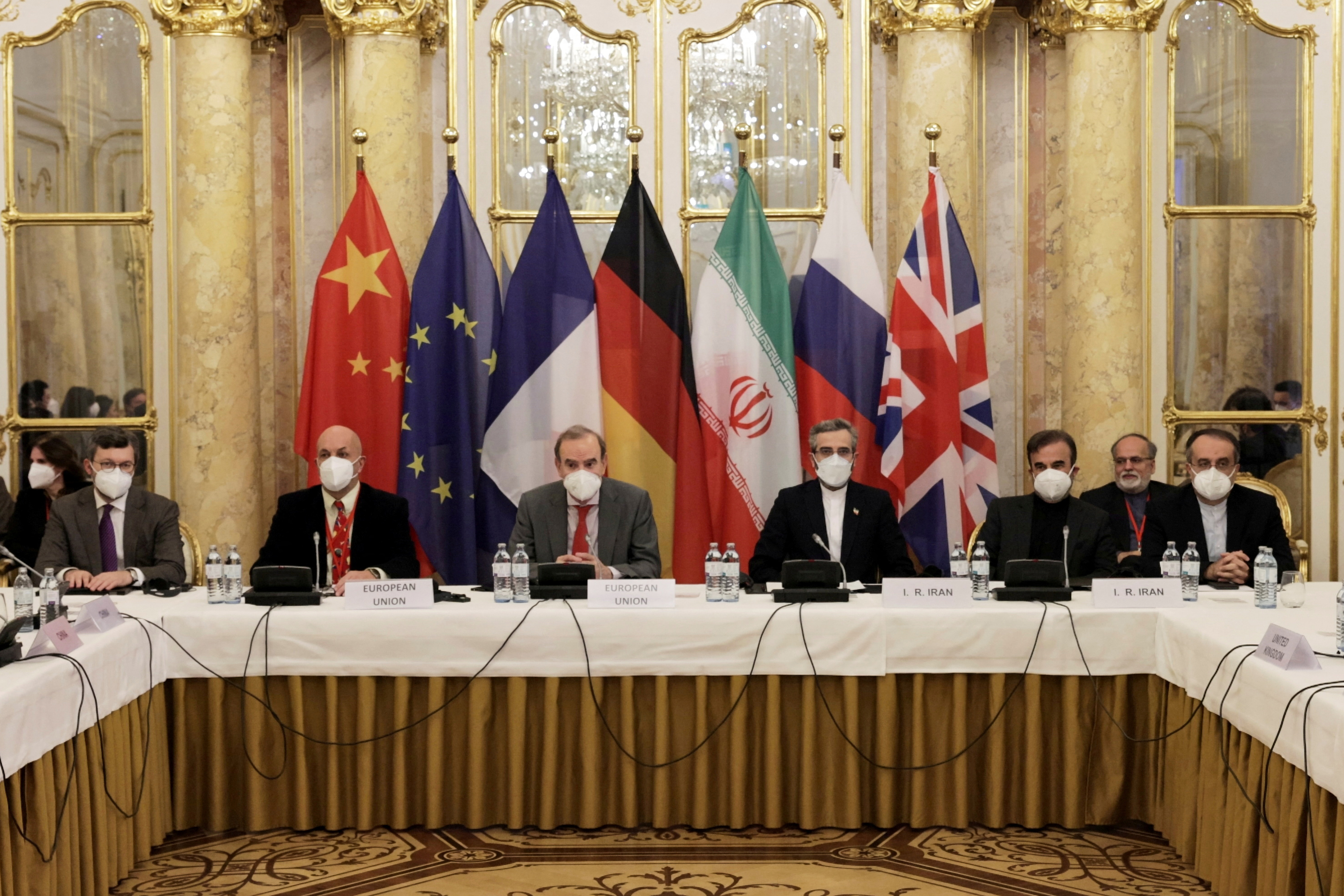 Deputy Secretary General of the European External Action Service (EEAS) Enrique Mora and Iran's chief nuclear negotiator Ali Bagheri Kani and delegations wait for the start of a meeting of the JCPOA Joint Commission in Vienna