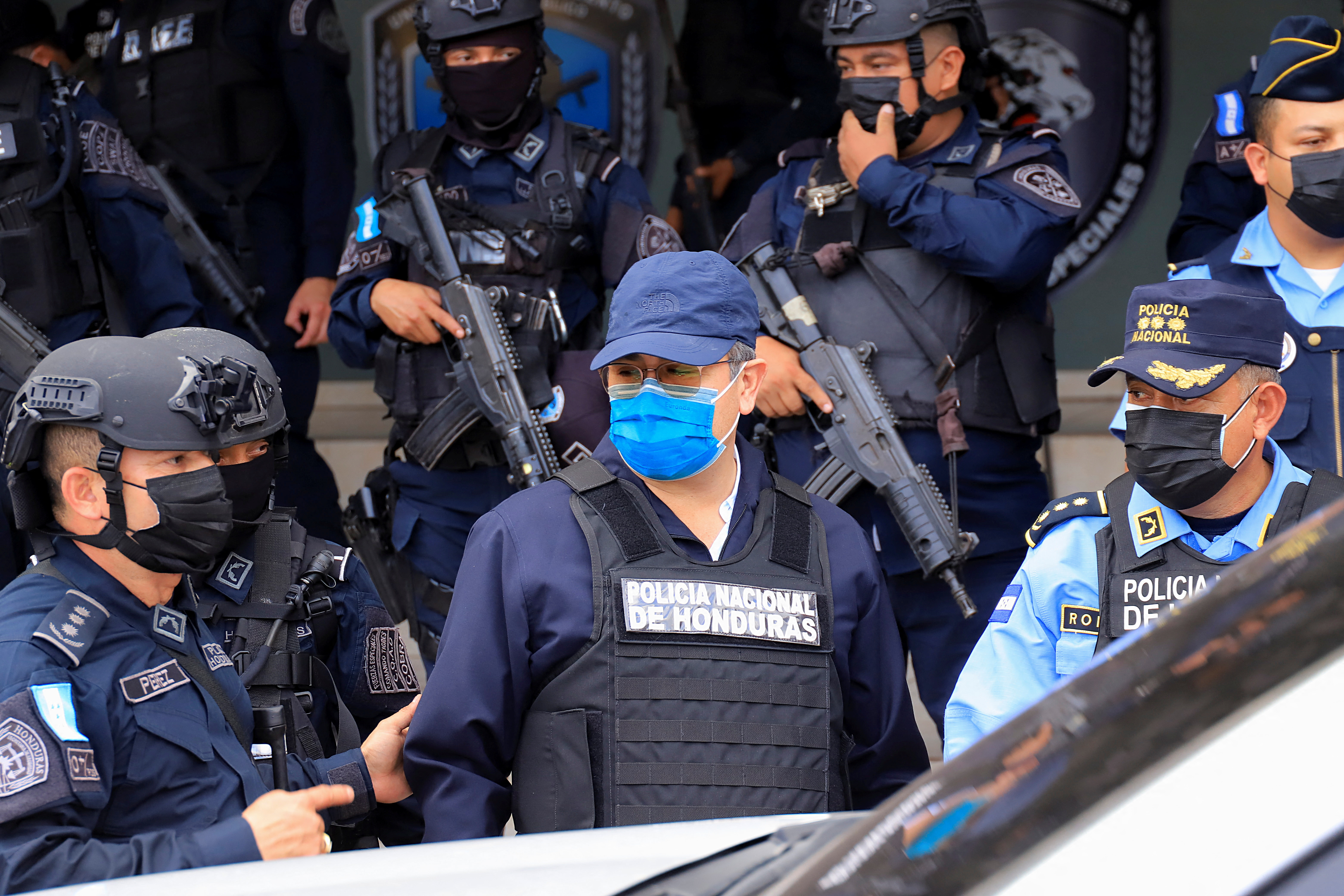 Juan Orlando Hernandez was arrested by police in Tegucigalpa, Honduras on Tuesday [Reuters]