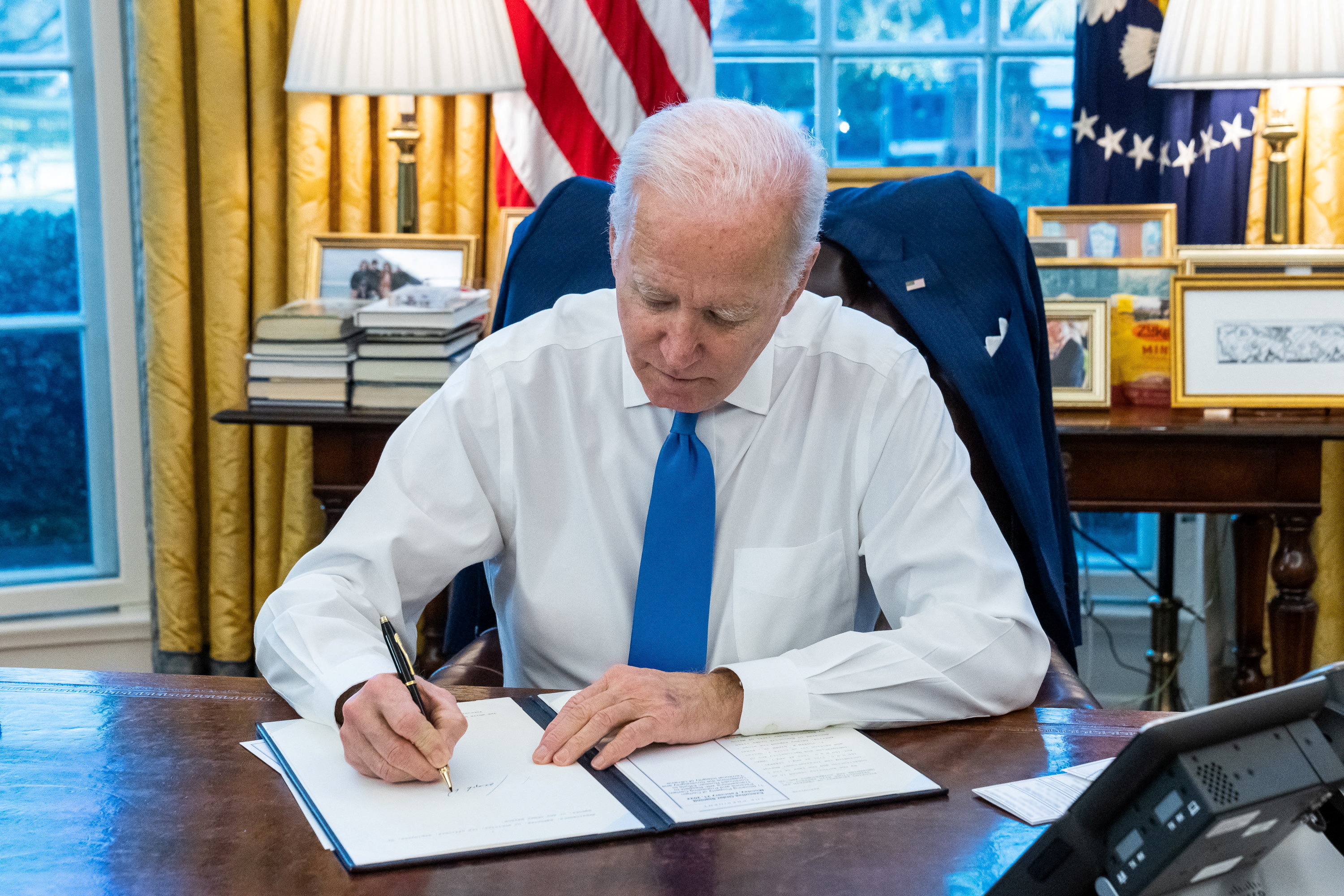 Biden has signed an executive order to ban all new investment, trade and financing by US citizens to, from, or in the so-called Donetsk and Luhansk People’s Republics regions of Ukraine [The White House via Reuters]