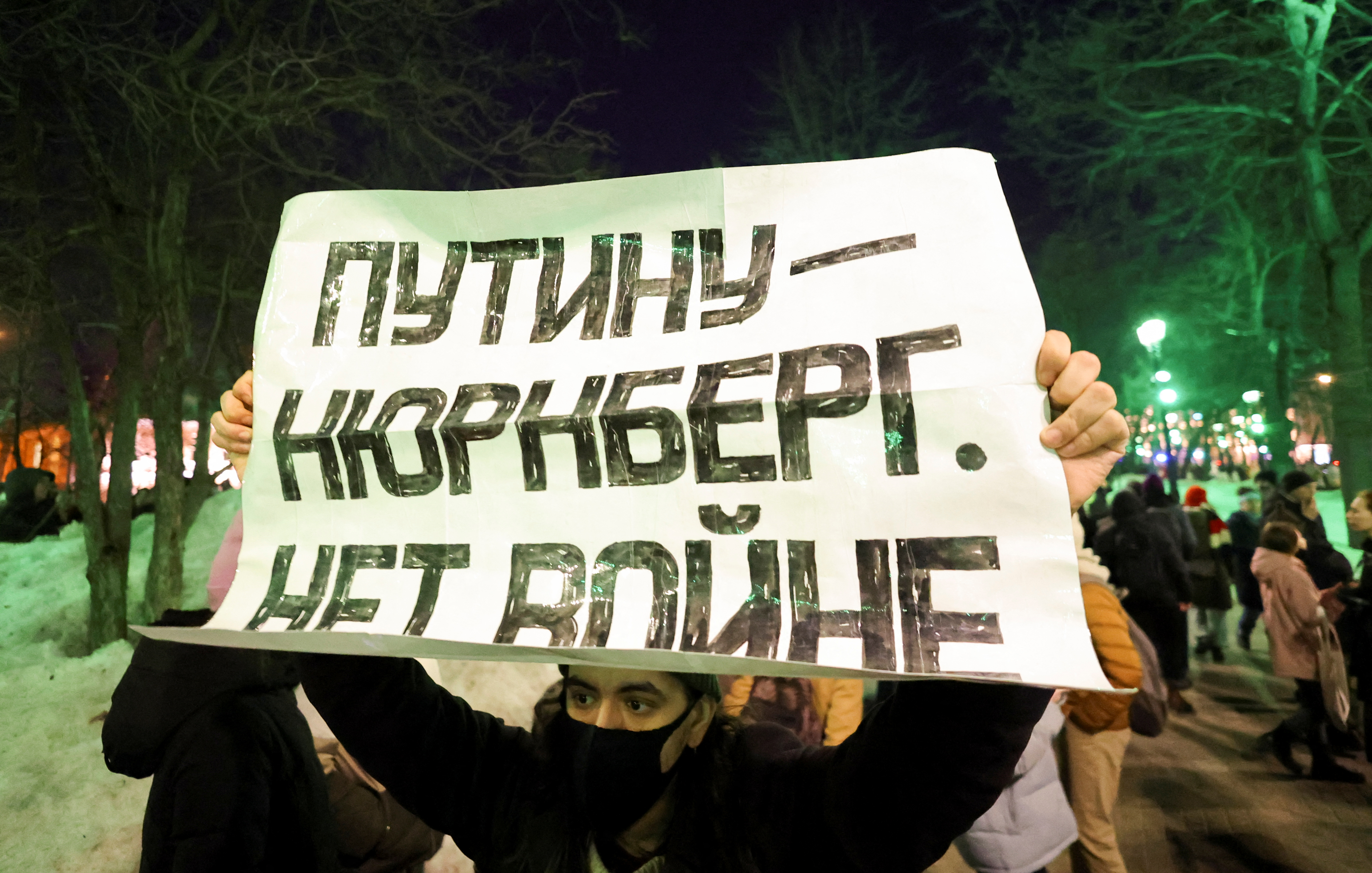 A person carries a banner during an anti-war protest, after Russia launched a massive military operation against Ukraine, in Moscow, Russia February 24, 2022. The banner reads "Putin - Nuremberg. No war".