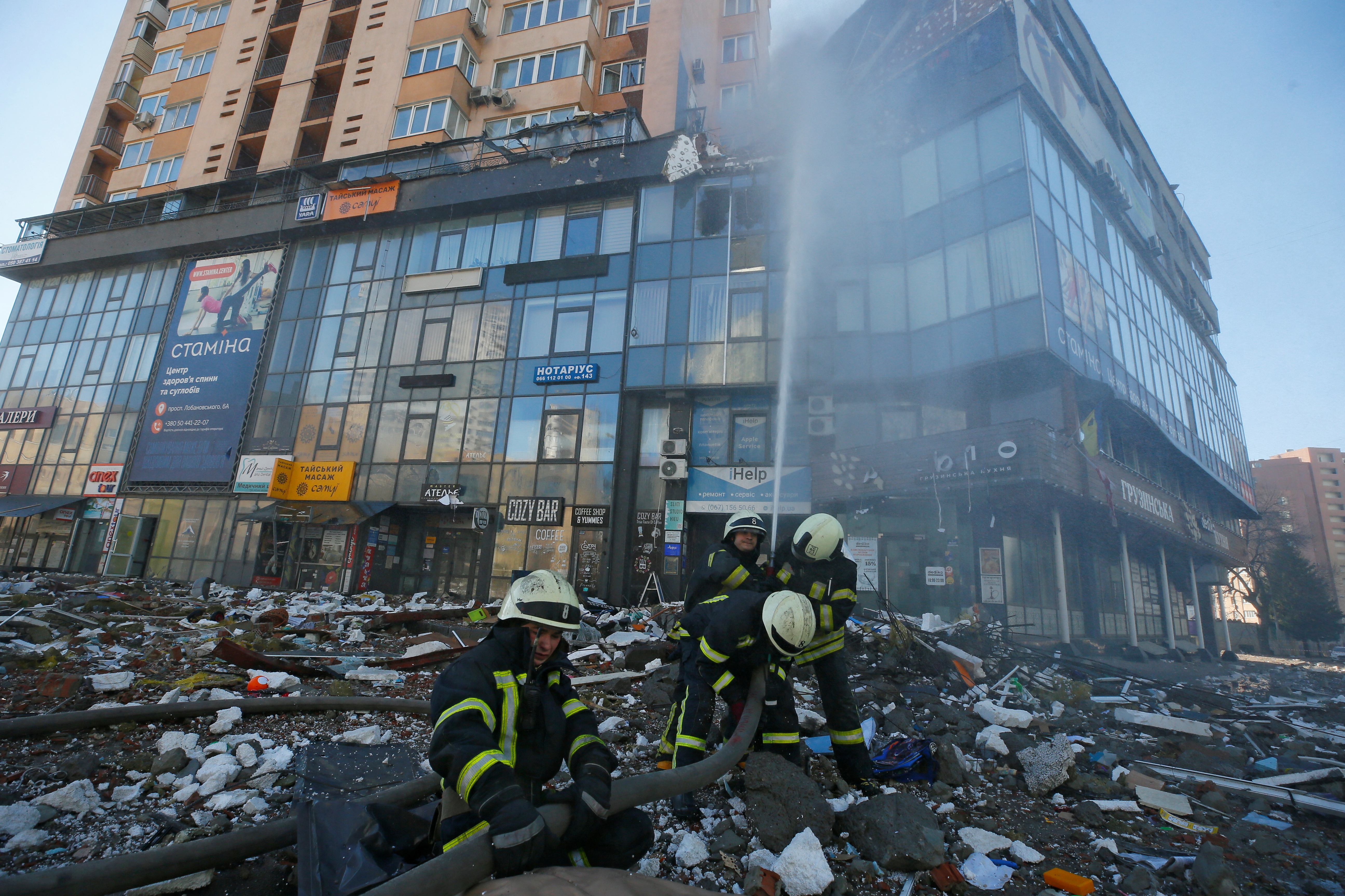 Firefighters extinguish fire in an apartment building